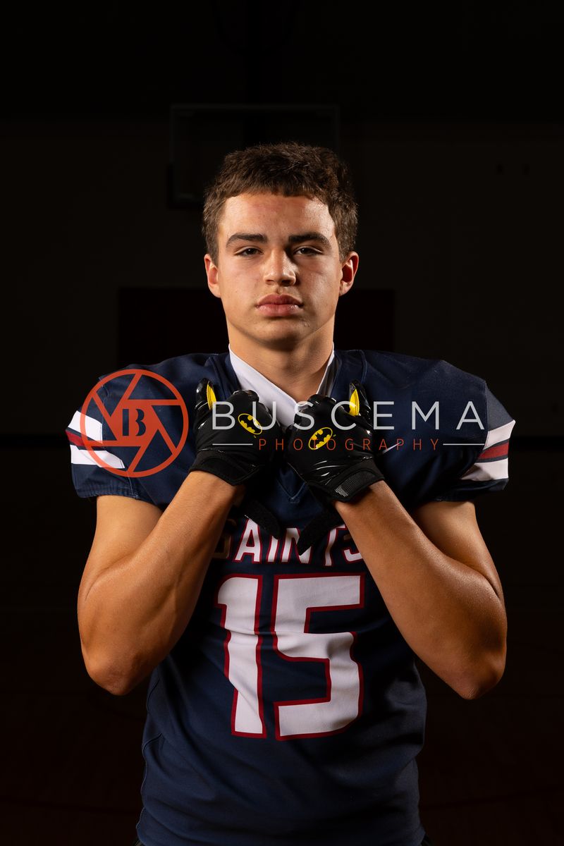 Coeur du Christ Academy Saints football player in a number 15 jersey