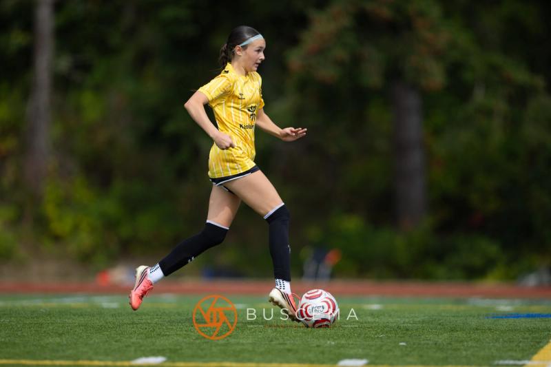 Sting 13-14G Academy player carrying the ball through midfield