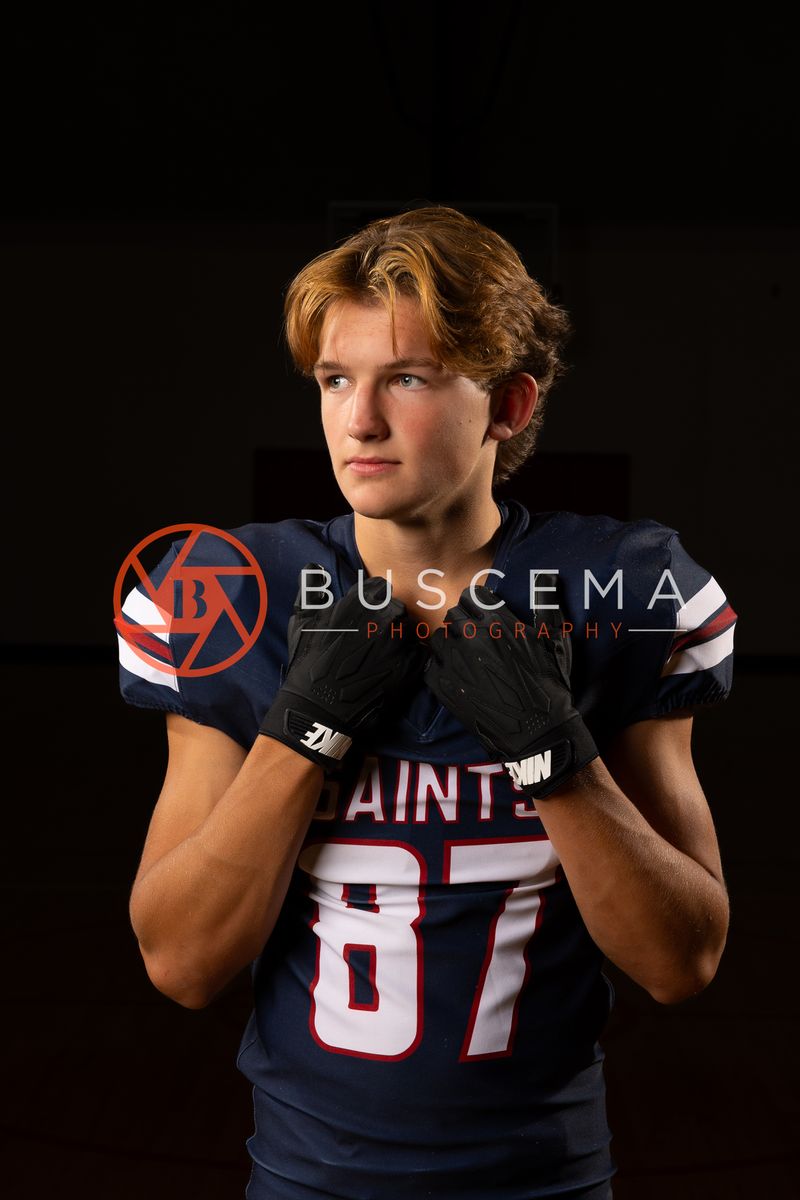 Coeur du Christ Academy Saints football player in a number 87 jersey