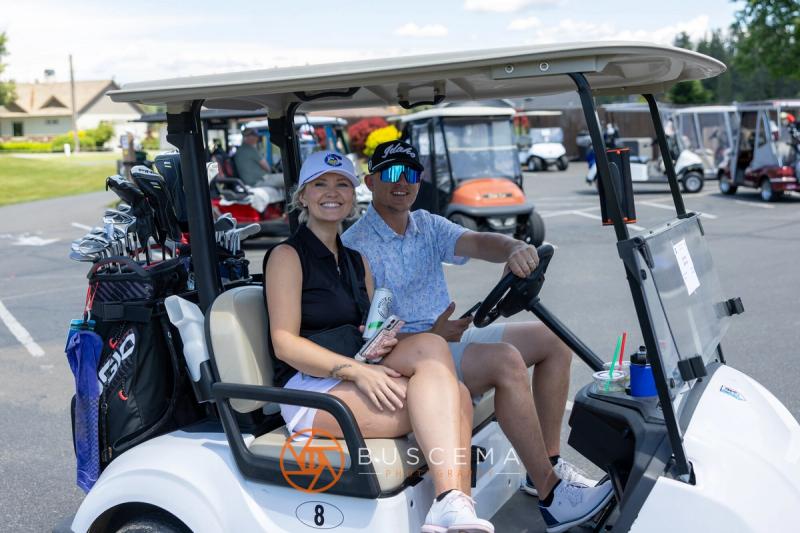 A couple smiling from cart 8 before the round