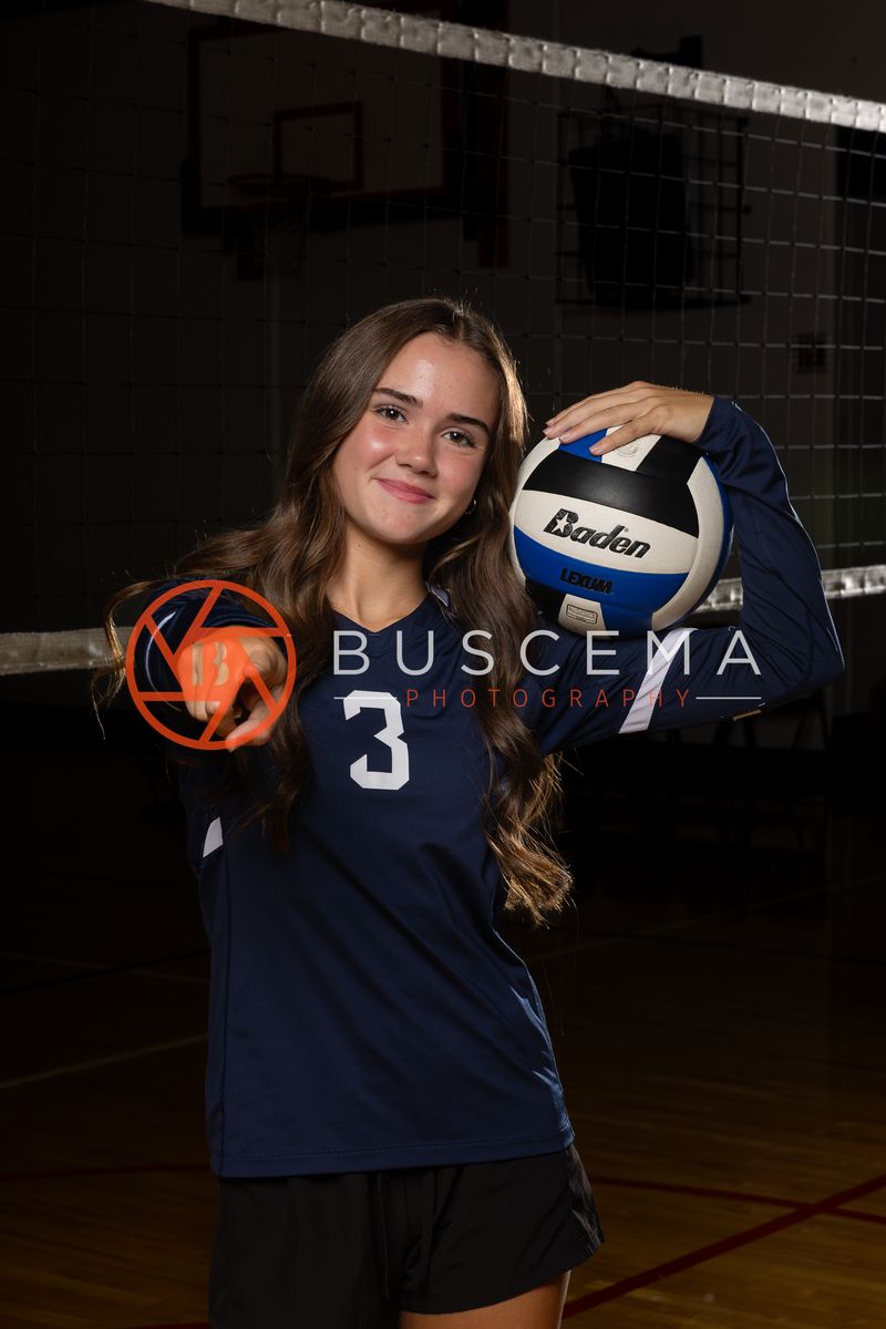 Coeur du Christ Academy volleyball player in a number 3 jersey with a volleyball