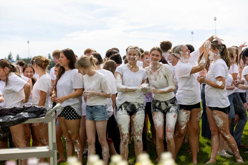 Coeur d'Alene seniors lined up behind the color powder bottles