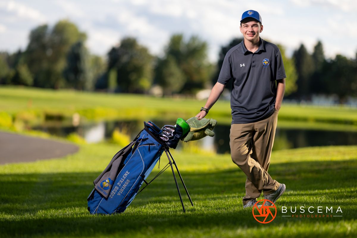 High school senior golf player. Coeur d'Alene Senior Portraits. By Jason Buscema, Coeur d'Alene, Idaho Senior Photographer.