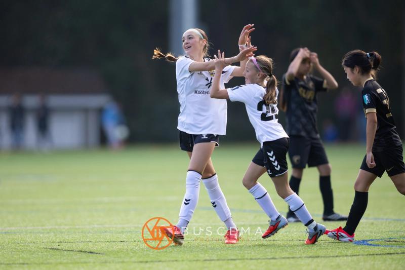 Sting 13G Academy players jumping to celebrate a goal
