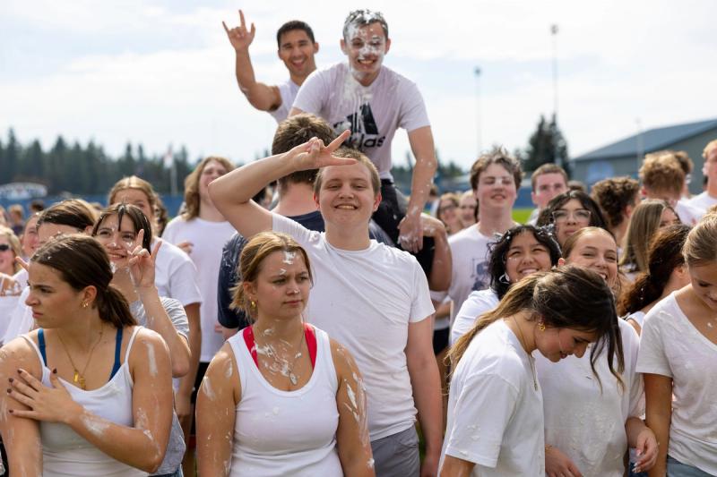 Coeur d'Alene seniors packed together with one student up on shoulders