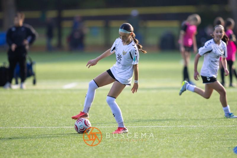 Sting 13G Academy player dribbling upfield