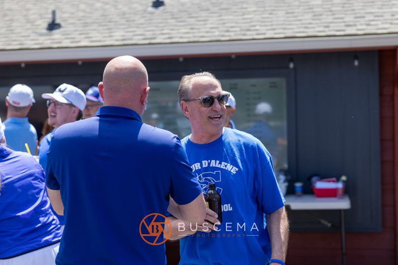 Two golfers greeting each other outside the clubhouse