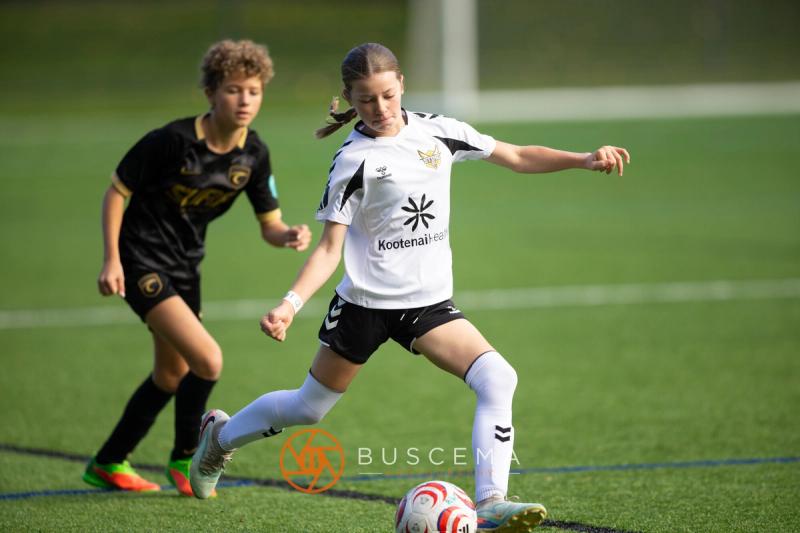 Sting 13G Academy player going one on one with a Western WA Surf player