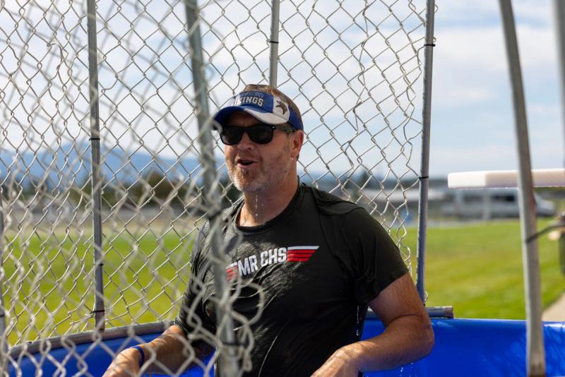 A man in a Vikings cap sitting in the dunk tank at the Coeur d'Alene senior kickoff
