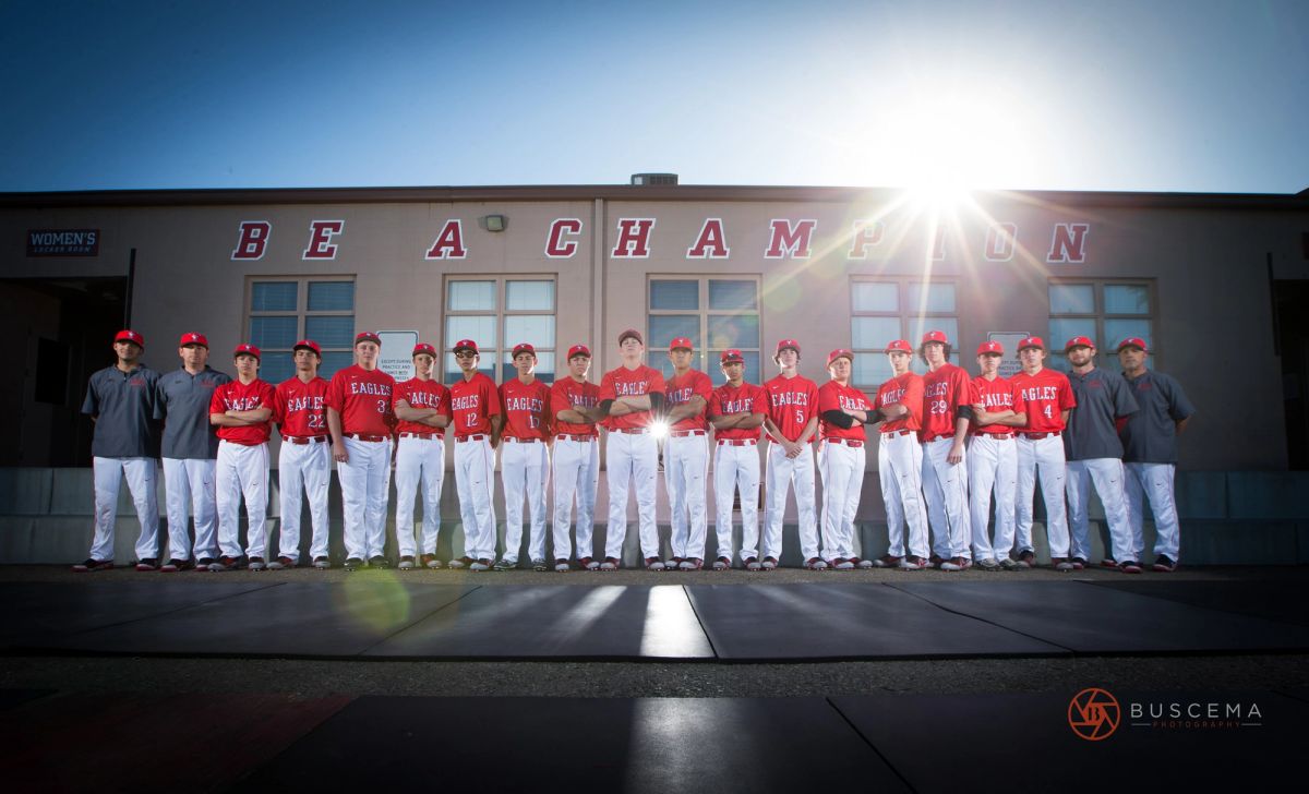 Beachampton Eagles baseball team posing in uniform in front of school building.