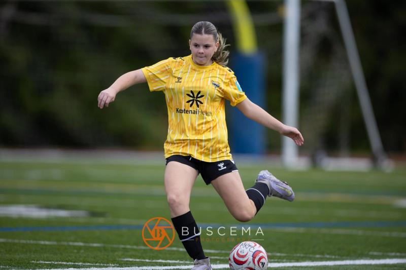 Sting 13-14G Academy player striking a long ball