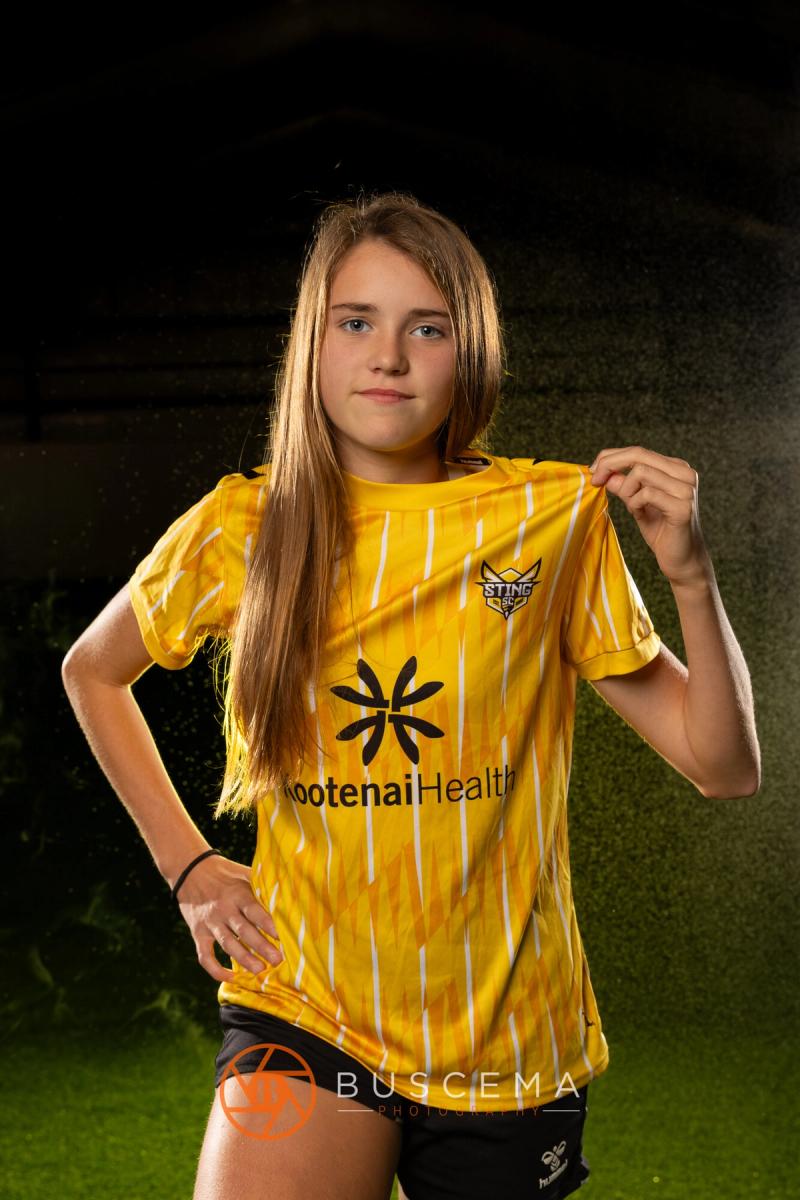 Sting 13G Academy player tugging on her jersey