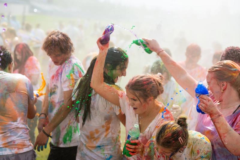 Coeur d'Alene seniors spraying each other with colored bottles