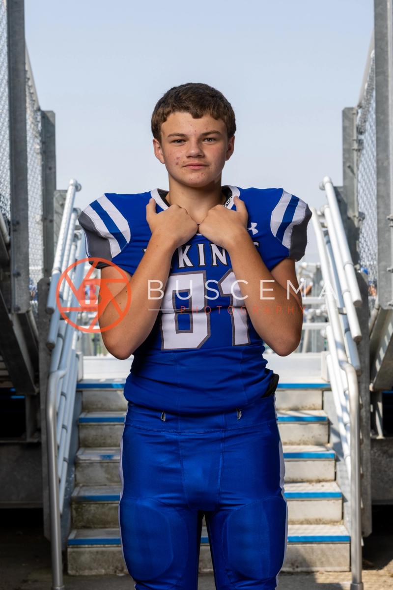 CHS Vikings football player in uniform on the stadium bleacher steps, 2026 season