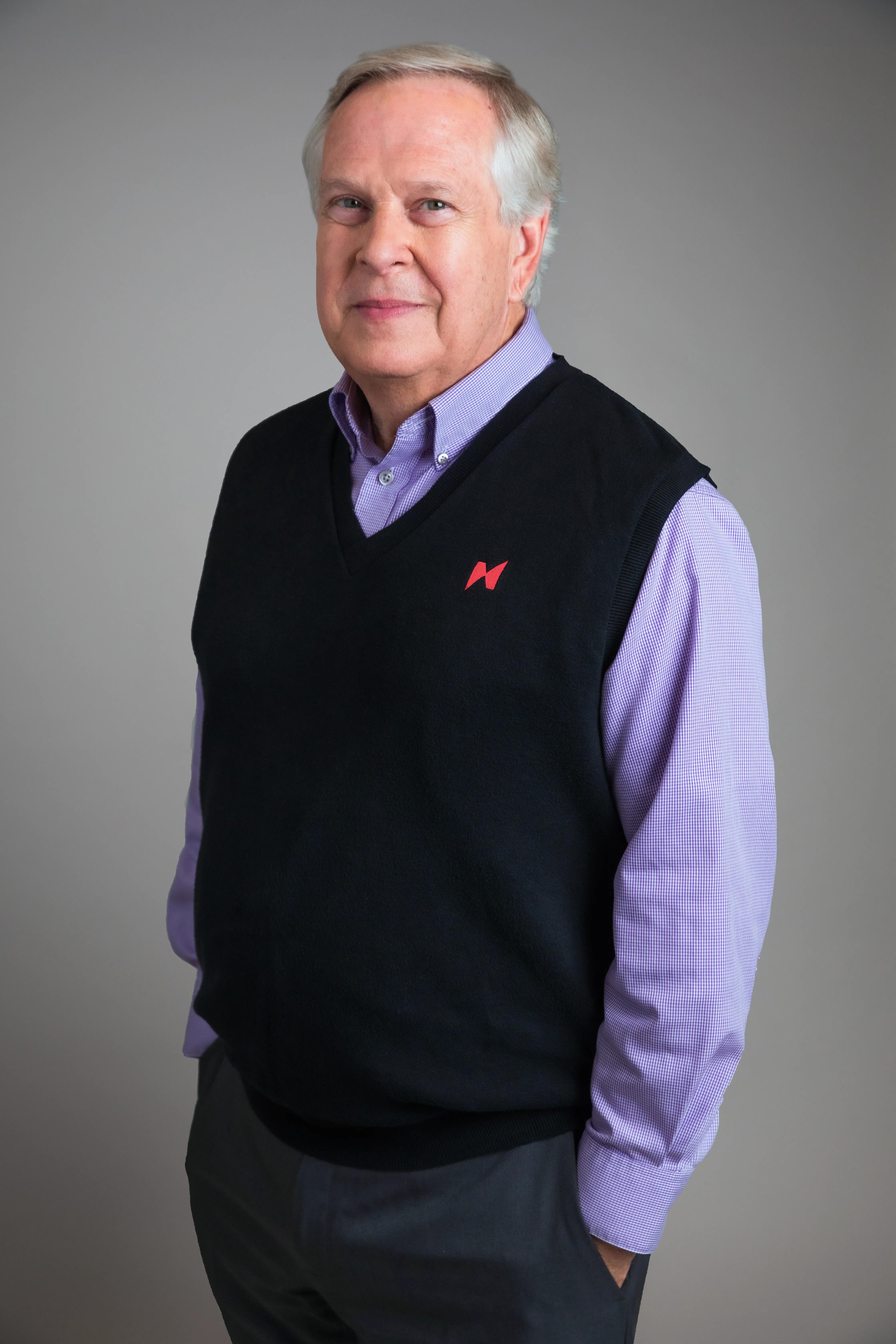 Portrait of John Putman on a gray background