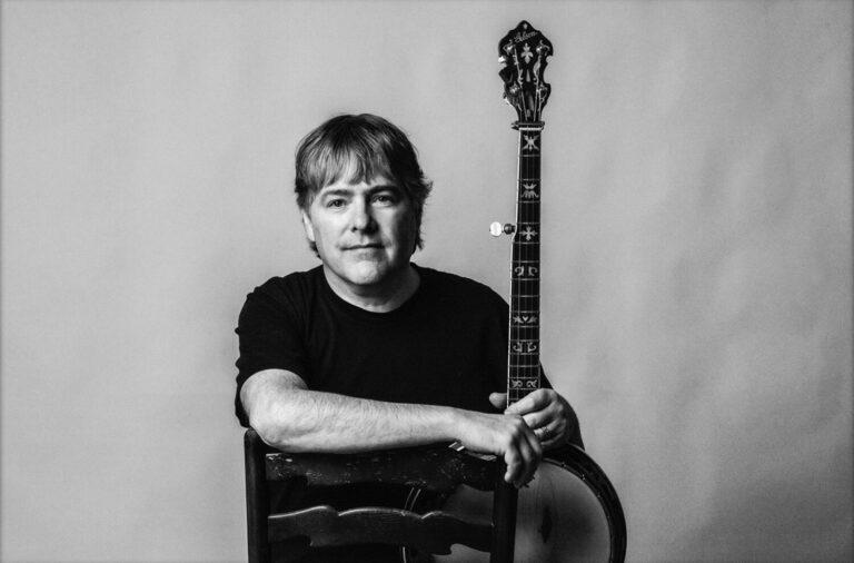 Béla Fleck, American musician, with his banjo recording an episode of the podcast "Utility + Function" with Nanotronics CEO Matthew Putman