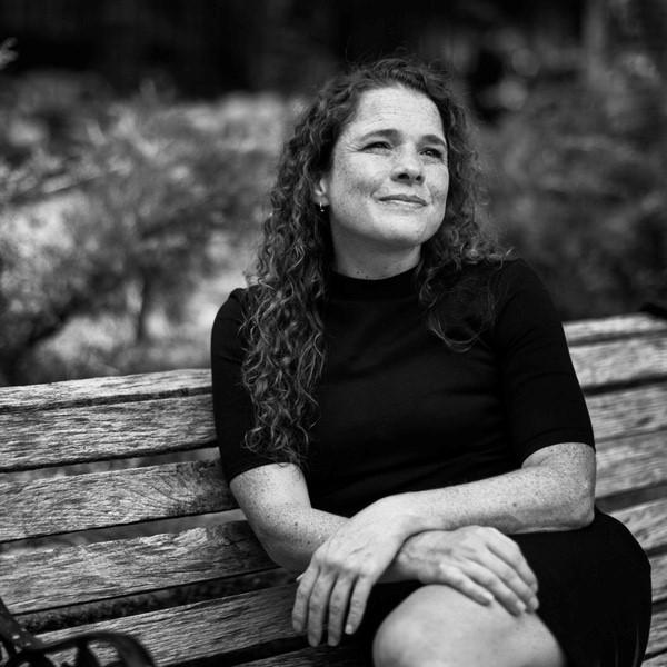 Sarah Williams, Associate Professor of Technology and Urban Planning and Director of the Civic Data Design Lab at MIT’s School of Architecture and Planning, on a bench recording an episode of the podcast "Utility + Function" with Nanotronics CEO Matthew Putman