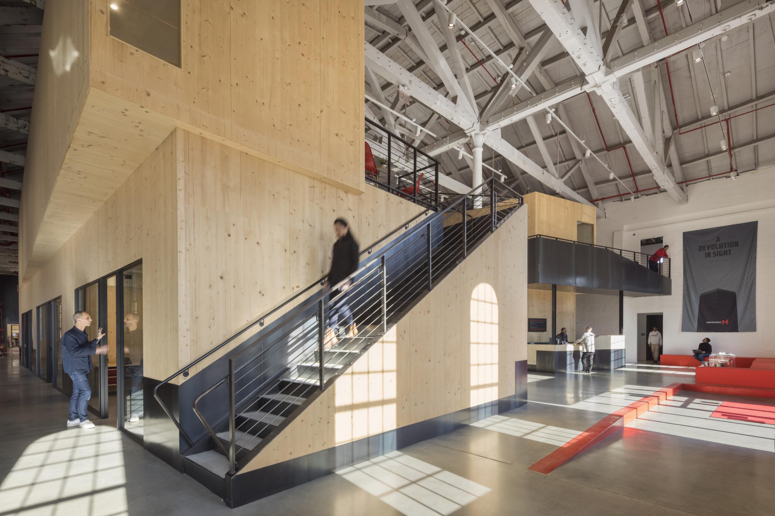 Interior of Nanotronics Headquarters with modern staircase in industrial building