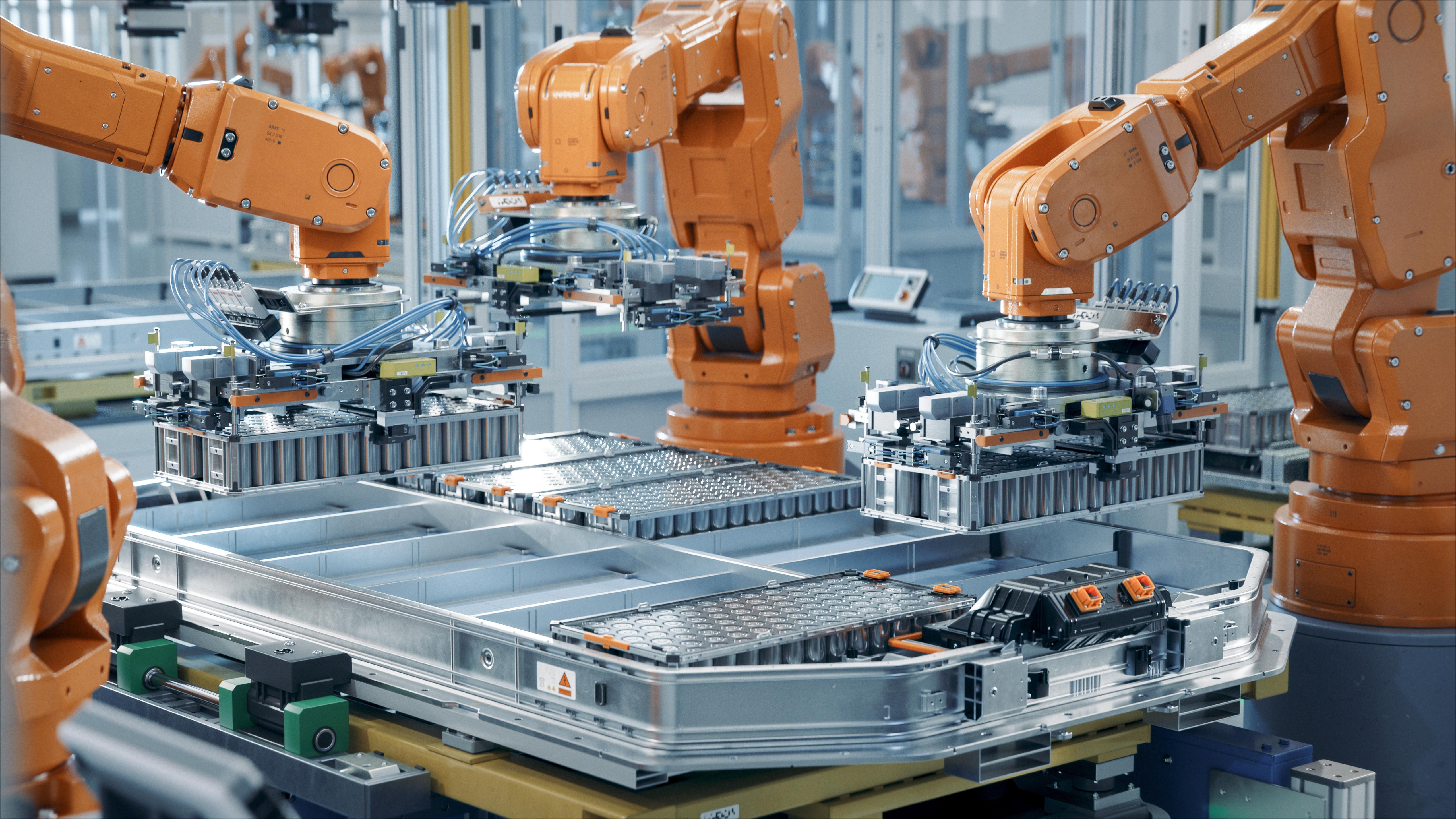 Automotive EV battery assembly line with industrial robotic arms