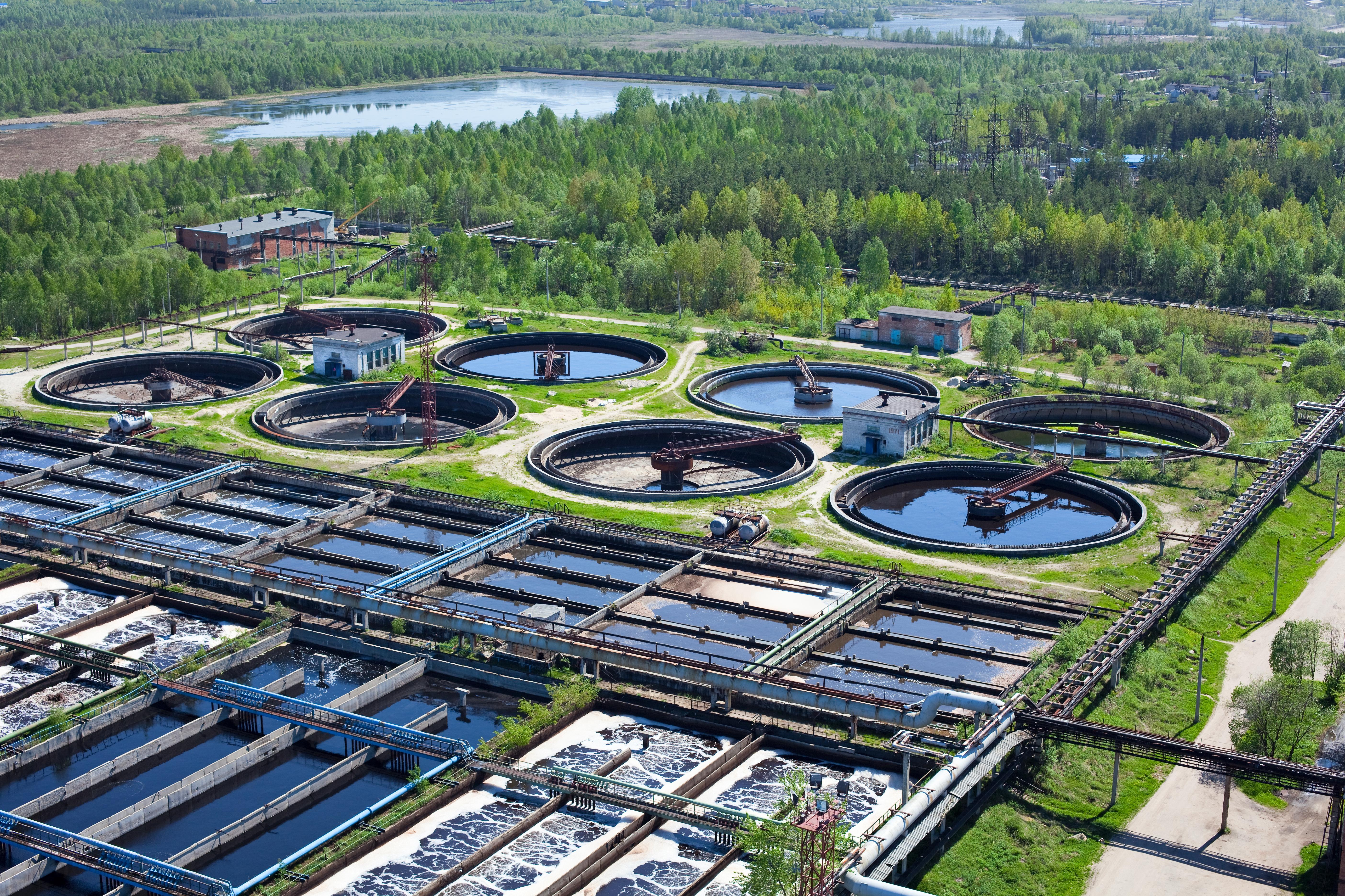 Aerial view of industrial chemical manufacturing plant in lush green environment