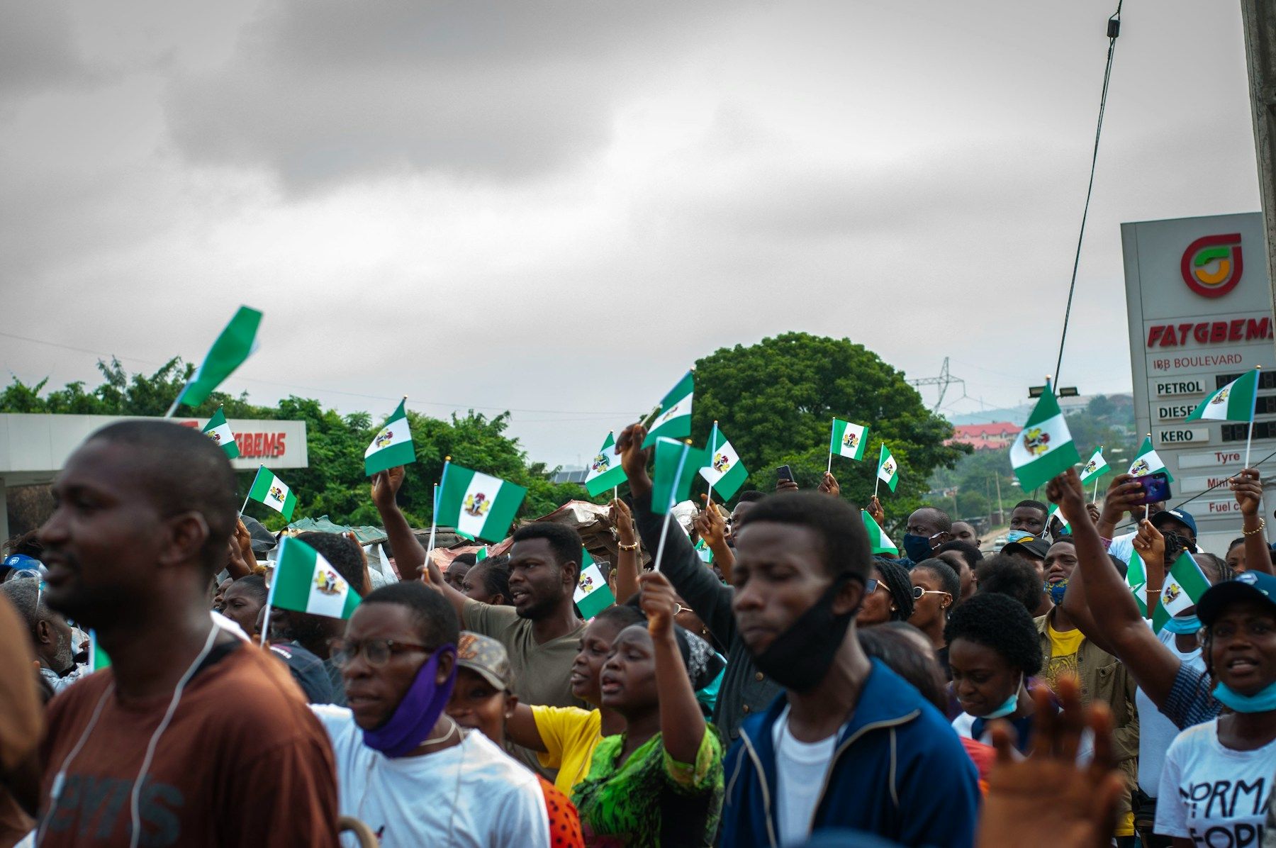 A large group of young people gathered on a field