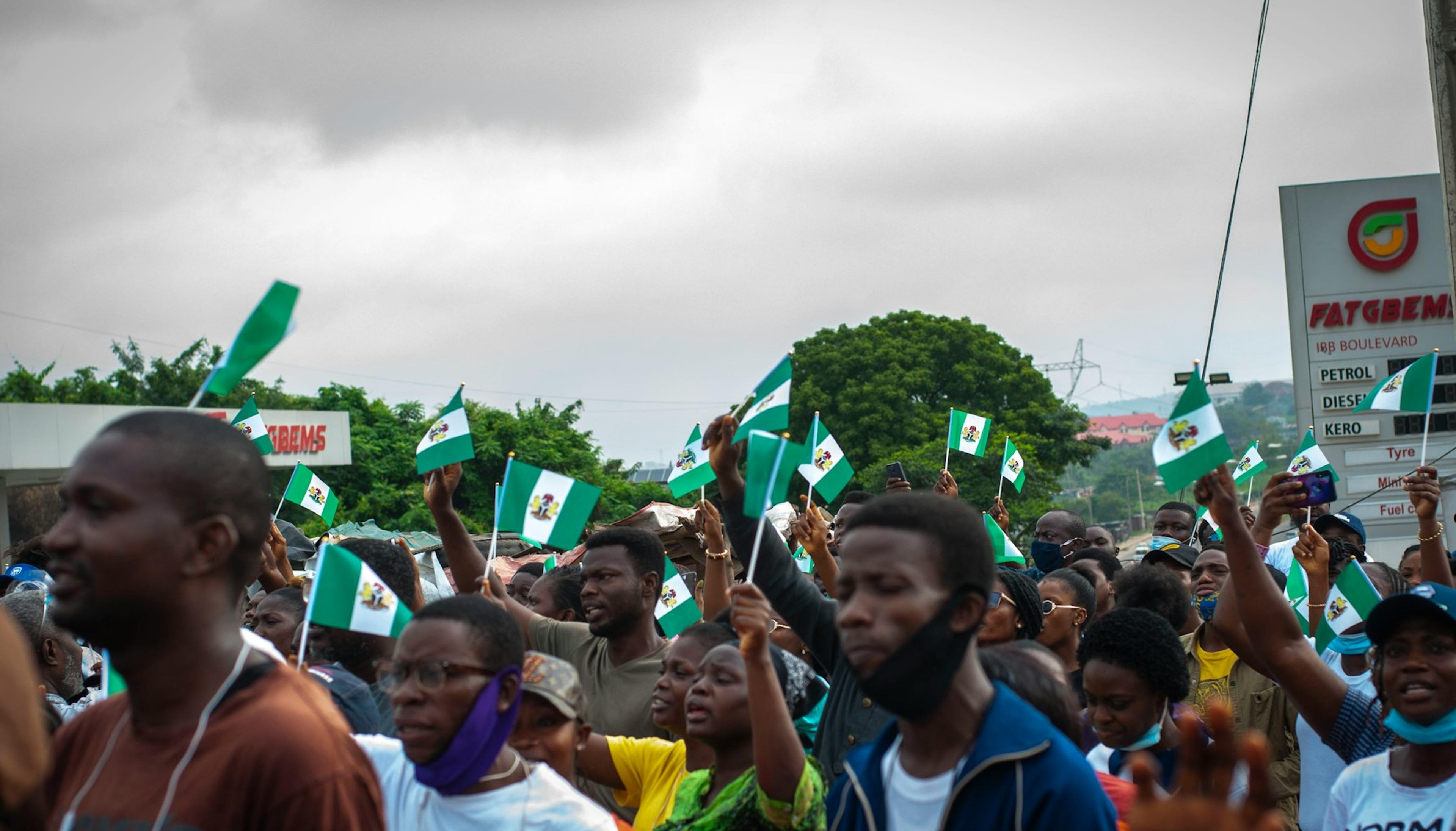 A large group of young people gathered on a field