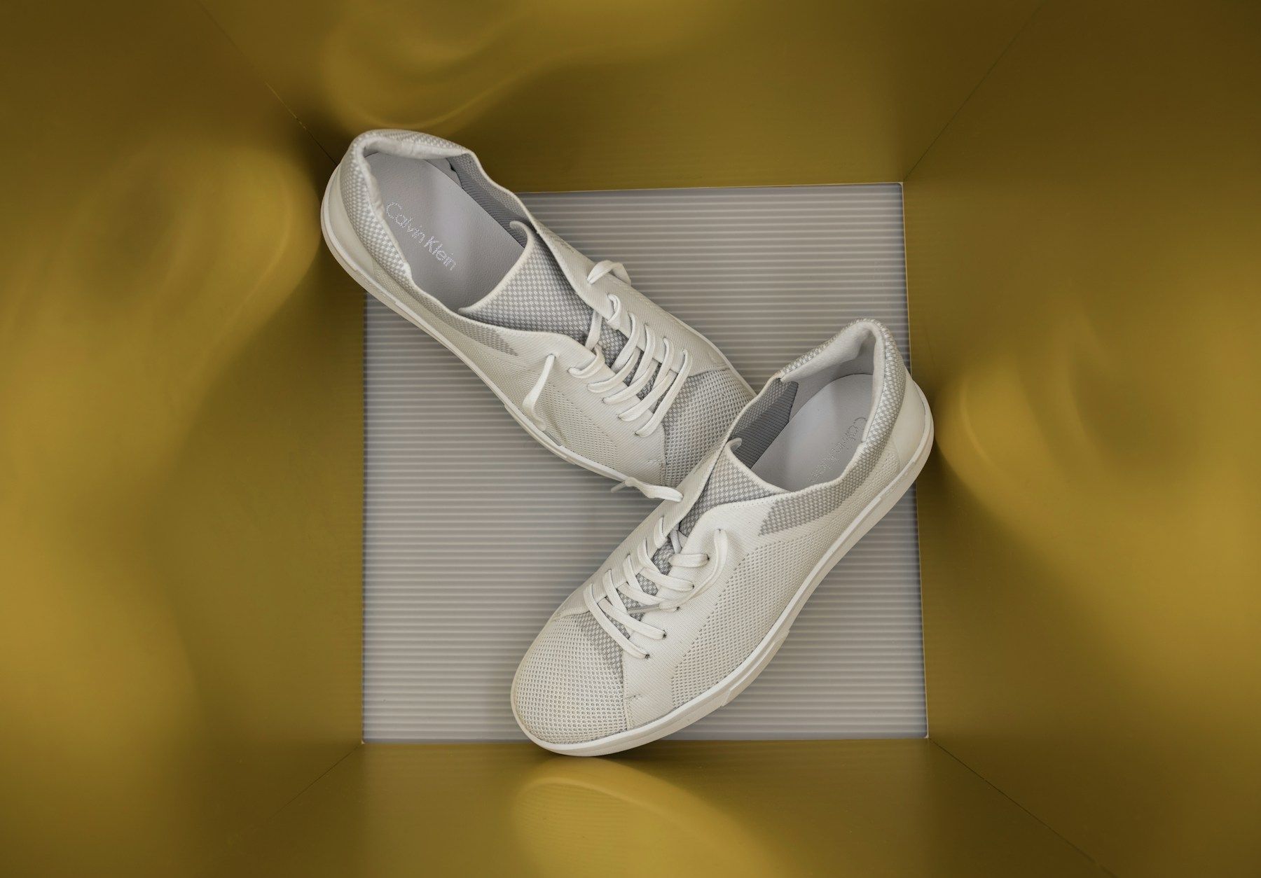 A pair of white sneakers
