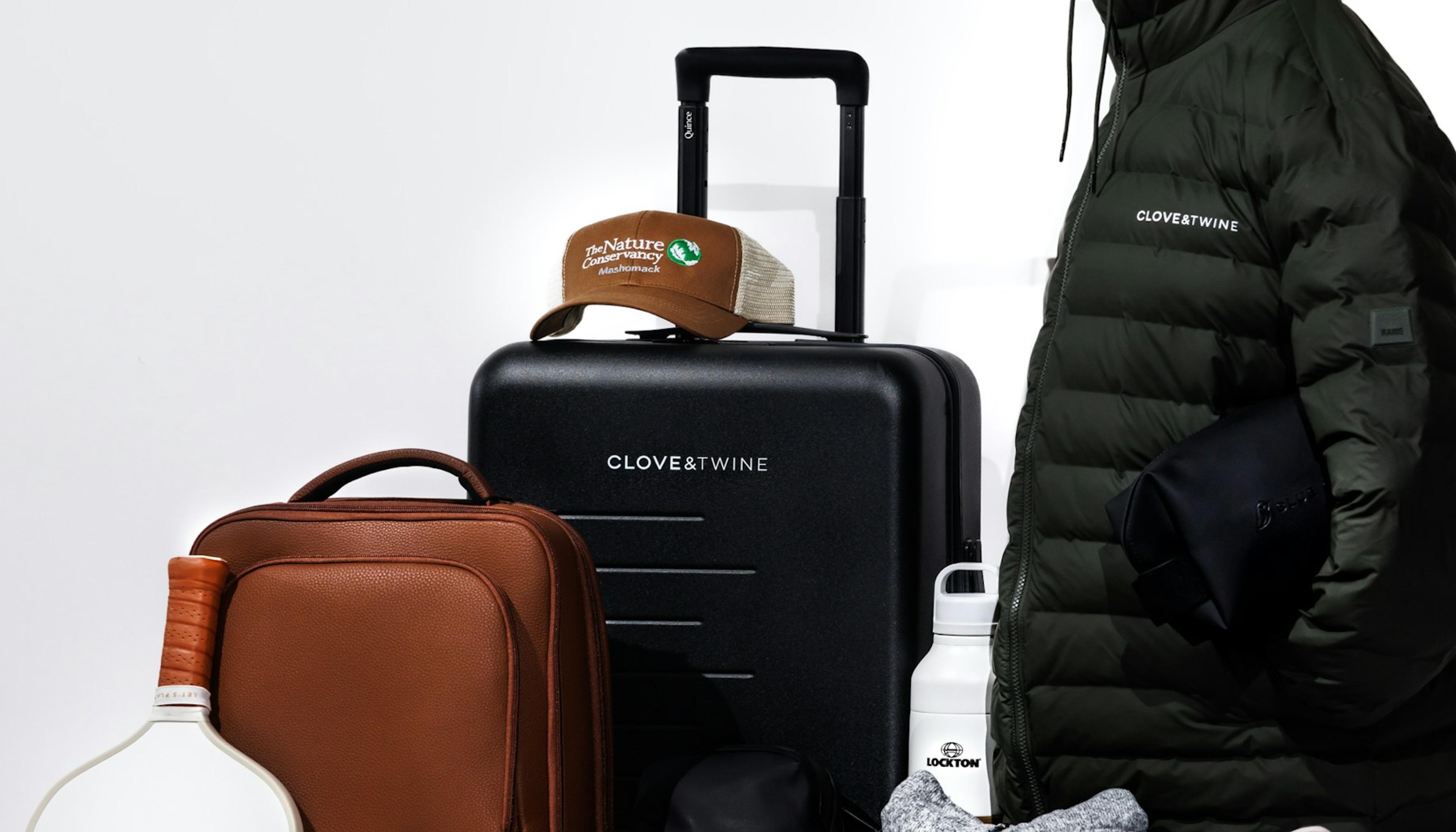 Travel essentials and clothing laid out for packing