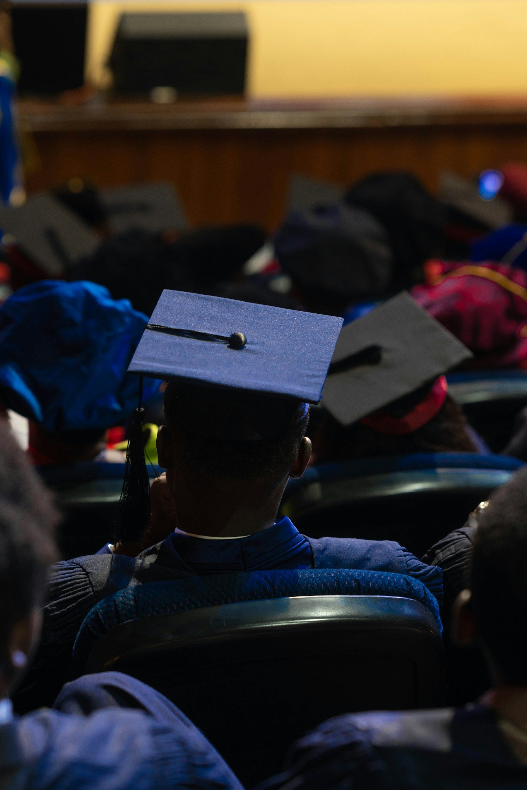 Graduates in caps and gowns at a graduation ceremony