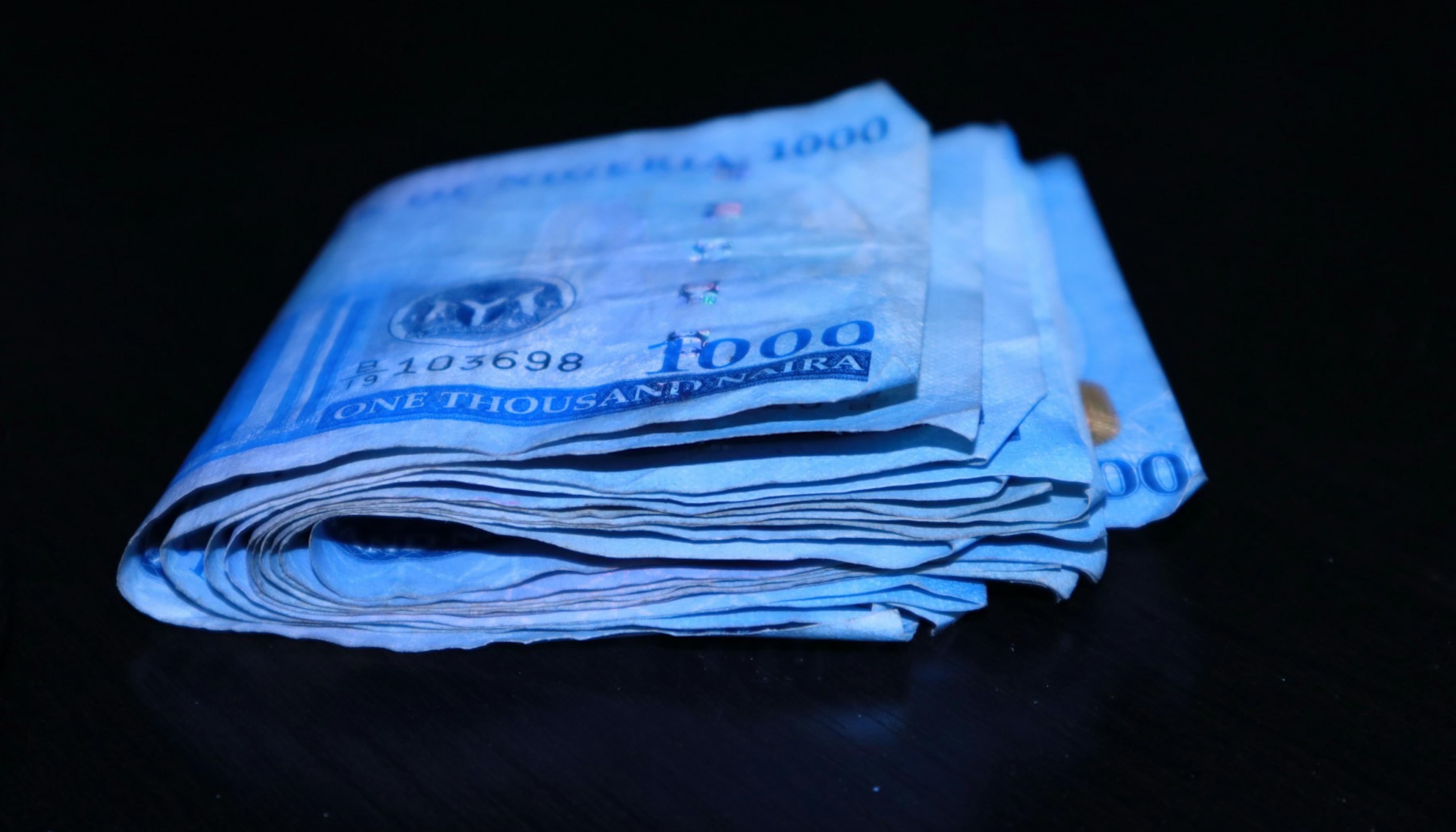 Folded naira notes on a table