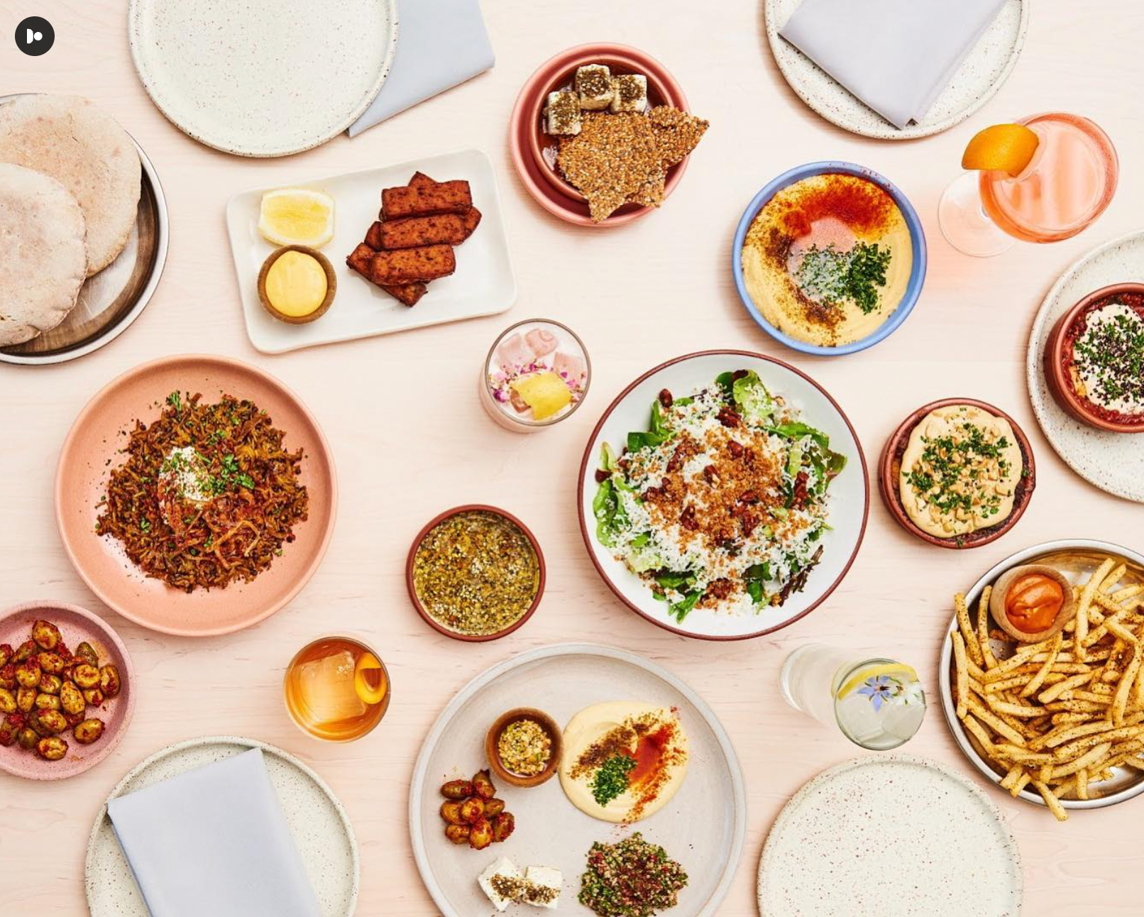 A colorful table top of several Tusk dishes. 