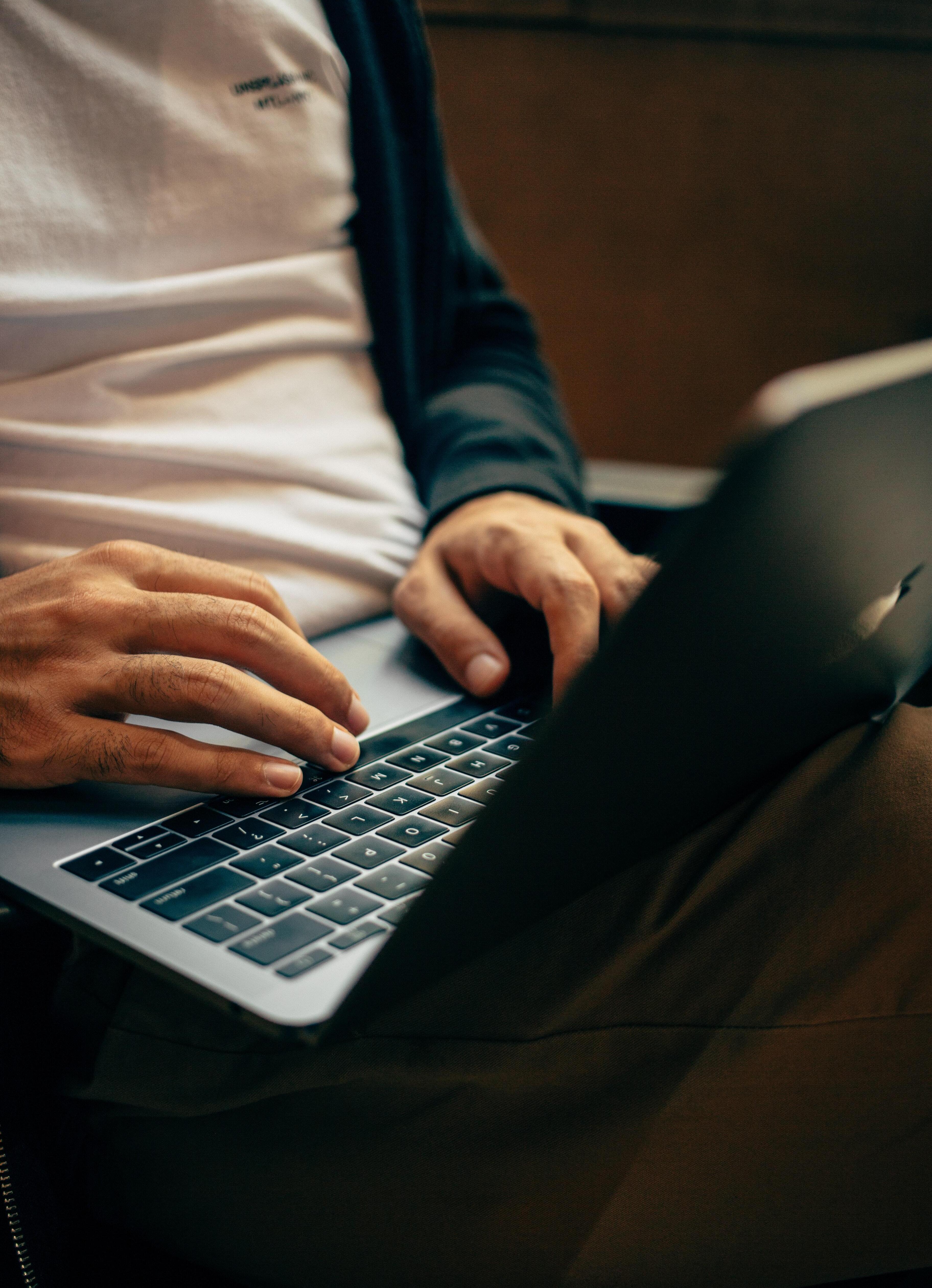 A person writing on his computer
