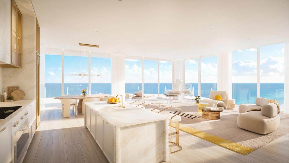 Full-height crystal-clear glass panels and expansive private balconies give the feeling of being suspended in space between sand, sea, and sky.