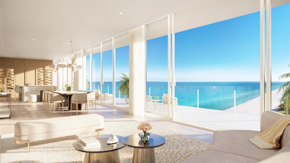 Full-height crystal-clear glass panels and expansive private balconies give the feeling of being suspended in space between sand, sea, and sky.