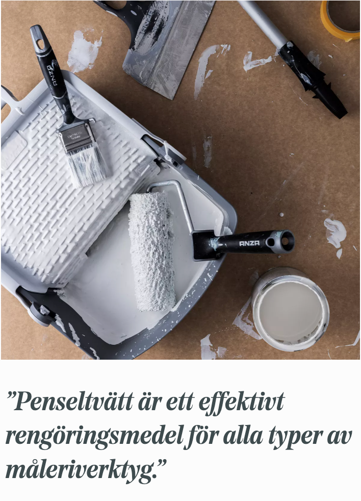 Paint roller in a tray, paintbrush, and open paint can with white paint on a brown, splattered surface.