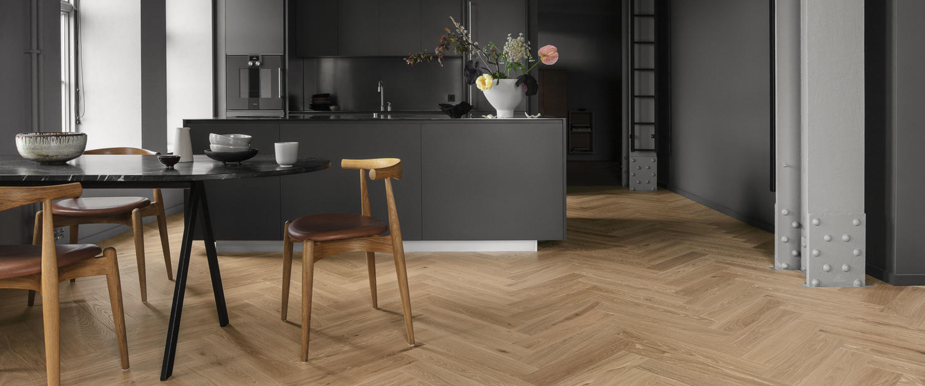 Modern open-plan kitchen and dining area with dark gray cabinetry, a black table, wooden chairs, and light herringbone wood floors.​​​​‌﻿‍﻿​‍​‍‌‍﻿﻿‌﻿​‍‌‍‍‌‌‍‌﻿‌‍‍‌‌‍﻿‍​‍​‍​﻿‍‍​‍​‍‌﻿​﻿‌‍​‌‌‍﻿‍‌‍‍‌‌﻿‌​‌﻿‍‌​‍﻿‍‌‍‍‌‌‍﻿﻿​‍​‍​‍﻿​​‍​‍‌‍‍​‌﻿​‍‌‍‌‌‌‍‌‍​‍​‍​﻿‍‍​‍​‍‌‍‍​‌﻿‌​‌﻿‌​‌﻿​​‌﻿​﻿​﻿‍‍​‍﻿﻿​‍﻿﻿‌﻿‌﻿‌﻿‌﻿‌﻿‌﻿​‍﻿‍‌‍​﻿‌‍﻿﻿‌‍﻿​‌‍﻿﻿‌﻿​‍‌‍​‌‌‍﻿‌‌‍​‌​‍﻿‍‌﻿​﻿‌‍‌‌​‍﻿﻿‌﻿​﻿‌﻿‌​‌﻿‌‌‌‍‌​‌‍‍‌‌‍﻿﻿​‍﻿﻿‌‍‍‌‌‍﻿‍‌﻿‌​‌‍‌‌‌‍﻿‍‌﻿‌​​‍﻿﻿‌‍‌‌‌‍‌​‌‍‍‌‌﻿‌​​‍﻿﻿‌‍﻿‌‌‍﻿﻿‌‍‌​‌‍‌‌​﻿﻿‌‌﻿​​‌﻿​‍‌‍‌‌‌﻿​﻿‌‍‌‌‌‍﻿‍‌﻿‌​‌‍​‌‌﻿‌​‌‍‍‌‌‍﻿﻿‌‍﻿‍​﻿‍﻿‌‍‍‌‌‍‌​​﻿﻿‌​﻿‍​​﻿​﻿​﻿‌‌‌‍‌​​﻿​﻿‌‍​‍‌‍​‍​﻿​‌​‍﻿‌‌‍‌​‌‍​﻿​﻿‍​​﻿‍‌​‍﻿‌​﻿‌​‌‍​‍‌‍​﻿​﻿​﻿​‍﻿‌​﻿‍‌​﻿​﻿​﻿​​​﻿​‌​‍﻿‌‌‍​﻿​﻿​﻿‌‍‌‌​﻿​﻿‌‍‌‌​﻿​‍‌‍‌‌​﻿​​‌‍‌​‌‍​‍​﻿‌‌​﻿​﻿​﻿‍﻿‌﻿‌​‌﻿‍‌‌﻿​​‌‍‌‌​﻿﻿‌‌‍​﻿‌‍﻿﻿‌‍﻿‍‌﻿‌​‌‍‌‌‌‍﻿‍‌﻿‌​‌‌​​‌‍​‌‌‍‌﻿‌‍‌‌​﻿‍﻿‌﻿​​‌‍​‌‌﻿‌​‌‍‍​​﻿﻿‌‌‍​﻿‌‍﻿﻿‌‍﻿‍‌﻿‌​‌‍‌‌‌‍﻿‍‌﻿‌​‌​​‍‌‍﻿​‌‍﻿﻿‌‍​﻿‌‍‍﻿‌﻿​﻿​‍‌‌​﻿‌‌‌​​‍‌‌﻿﻿‌‍‍﻿‌‍‌‌‌﻿‍‌​‍‌‌​﻿​﻿‌​‌​​‍‌‌​﻿​﻿‌​‌​​‍‌‌​﻿​‍​﻿​‍‌‍​﻿​﻿‍​​﻿​‍‌‍‌​​﻿​‌‌‍​‌​﻿​﻿​﻿​﻿‌‍‌​‌‍​‌‌‍​﻿​﻿​‍​‍‌‌​﻿​‍​﻿​‍​‍‌‌​﻿‌‌‌​‌​​‍﻿‍‌‍﻿‌‌‍‌‌‌‍‌​‌‍‍‌‌‍​‌​‍﻿‍‌‍‍‌‌‍﻿‌‌‍​‌‌‍‌﻿‌‍‌‌​‍﻿‍‌‍​‌‌‍﻿​‌﻿‌​‌‌‌​‌‍‌‌‌﻿‍​‌﻿‌​​﻿﻿﻿‌‍​‍‌‍​‌‌﻿​﻿‌‍‌‌‌‌‌‌‌﻿​‍‌‍﻿​​﻿﻿‌‌‍‍​‌﻿‌​‌﻿‌​‌﻿​​‌﻿​﻿​‍‌‌​﻿​﻿‌​​‌​‍‌‌​﻿​‍‌​‌‍​‍‌‌​﻿​‍‌​‌‍‌﻿‌﻿‌﻿‌﻿‌﻿‌﻿​‍﻿‍‌‍​﻿‌‍﻿﻿‌‍﻿​‌‍﻿﻿‌﻿​‍‌‍​‌‌‍﻿‌‌‍​‌​‍﻿‍‌﻿​﻿‌‍‌‌​‍‌‌​﻿​‍‌​‌‍‌﻿​﻿‌﻿‌​‌﻿‌‌‌‍‌​‌‍‍‌‌‍﻿﻿​‍‌‍‌‍‍‌‌‍‌​​﻿﻿‌​﻿‍​​﻿​﻿​﻿‌‌‌‍‌​​﻿​﻿‌‍​‍‌‍​‍​﻿​‌​‍﻿‌‌‍‌​‌‍​﻿​﻿‍​​﻿‍‌​‍﻿‌​﻿‌​‌‍​‍‌‍​﻿​﻿​﻿​‍﻿‌​﻿‍‌​﻿​﻿​﻿​​​﻿​‌​‍﻿‌‌‍​﻿​﻿​﻿‌‍‌‌​﻿​﻿‌‍‌‌​﻿​‍‌‍‌‌​﻿​​‌‍‌​‌‍​‍​﻿‌‌​﻿​﻿​‍‌‍‌﻿‌​‌﻿‍‌‌﻿​​‌‍‌‌​﻿﻿‌‌‍​﻿‌‍﻿﻿‌‍﻿‍‌﻿‌​‌‍‌‌‌‍﻿‍‌﻿‌​‌‌​​‌‍​‌‌‍‌﻿‌‍‌‌​‍‌‍‌﻿​​‌‍​‌‌﻿‌​‌‍‍​​﻿﻿‌‌‍​﻿‌‍﻿﻿‌‍﻿‍‌﻿‌​‌‍‌‌‌‍﻿‍‌﻿‌​‌​​‍‌‍﻿​‌‍﻿﻿‌‍​﻿‌‍‍﻿‌﻿​﻿​‍‌‌​﻿‌‌‌​​‍‌‌﻿﻿‌‍‍﻿‌‍‌‌‌﻿‍‌​‍‌‌​﻿​﻿‌​‌​​‍‌‌​﻿​﻿‌​‌​​‍‌‌​﻿​‍​﻿​‍‌‍​﻿​﻿‍​​﻿​‍‌‍‌​​﻿​‌‌‍​‌​﻿​﻿​﻿​﻿‌‍‌​‌‍​‌‌‍​﻿​﻿​‍​‍‌‌​﻿​‍​﻿​‍​‍‌‌​﻿‌‌‌​‌​​‍﻿‍‌‍﻿‌‌‍‌‌‌‍‌​‌‍‍‌‌‍​‌​‍﻿‍‌‍‍‌‌‍﻿‌‌‍​‌‌‍‌﻿‌‍‌‌​‍﻿‍‌‍​‌‌‍﻿​‌﻿‌​‌‌‌​‌‍‌‌‌﻿‍​‌﻿‌​​‍‌‍‌﻿​​‌‍‌‌‌﻿​‍‌﻿​﻿‌﻿​​‌‍‌‌‌‍​﻿‌﻿‌​‌‍‍‌‌﻿‌‍‌‍‌‌​﻿﻿‌‌﻿​​‌﻿‌‌‌‍​‍‌‍﻿​‌‍‍‌‌﻿​﻿‌‍‍​‌‍‌‌‌‍‌​​‍​‍‌﻿﻿‌