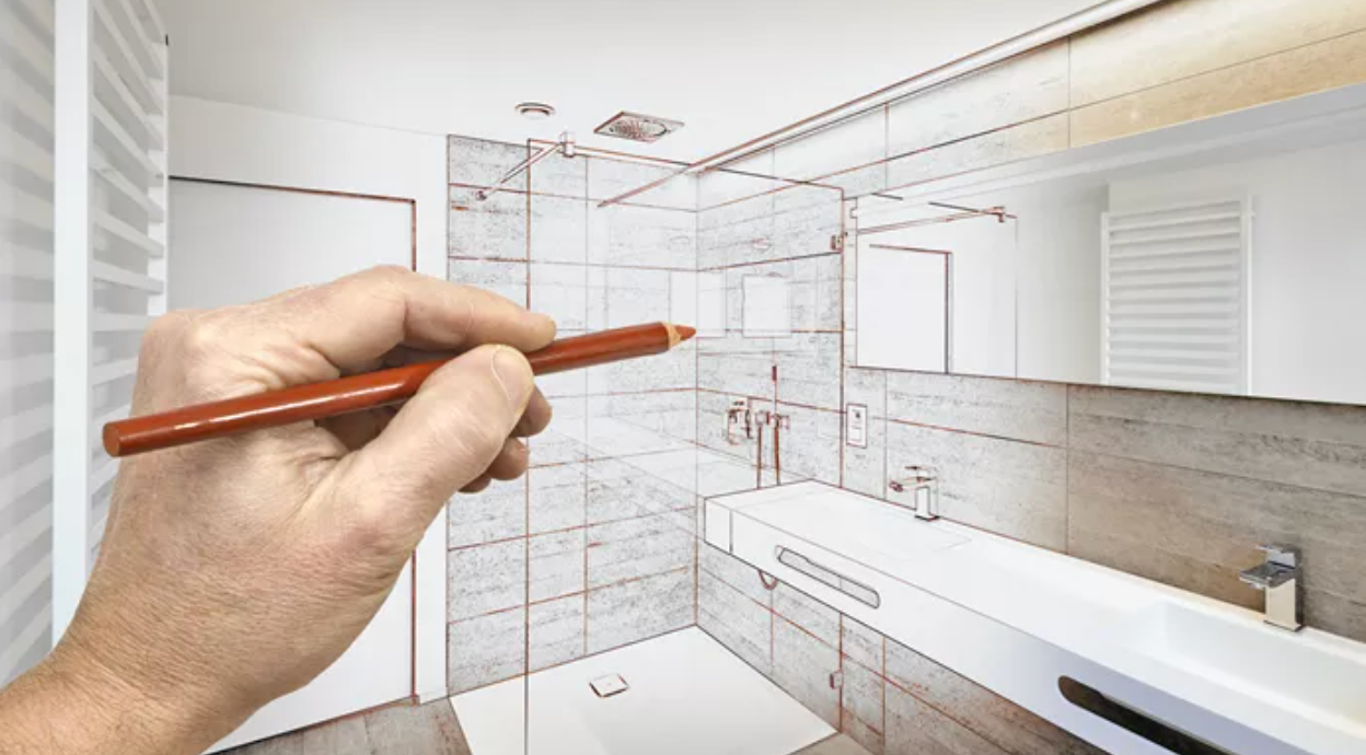 A hand drawing a modern bathroom design, blending sketch lines with a realistic photo.