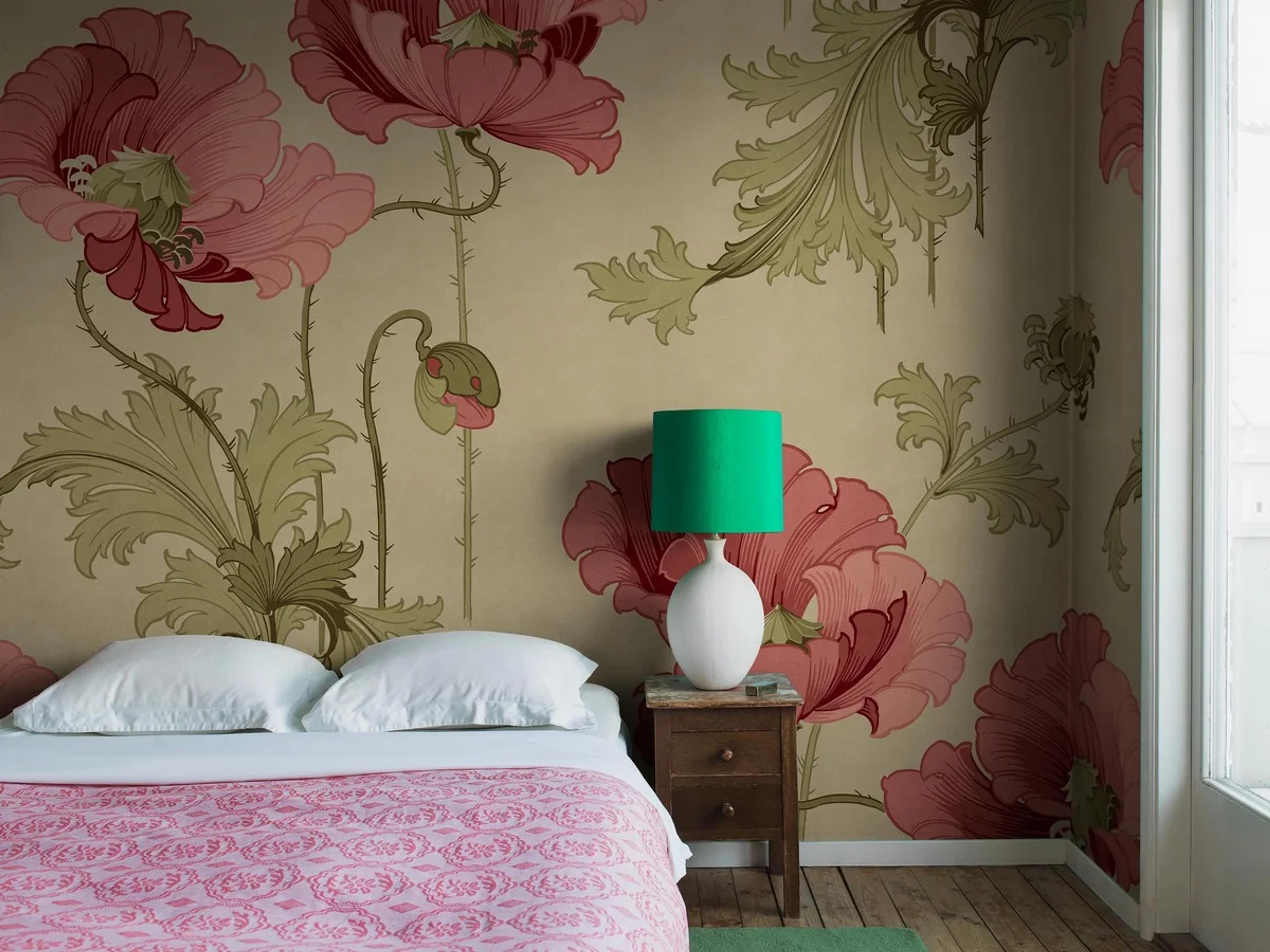 Interior view of a home decor store with wallpaper and textile samples on display.