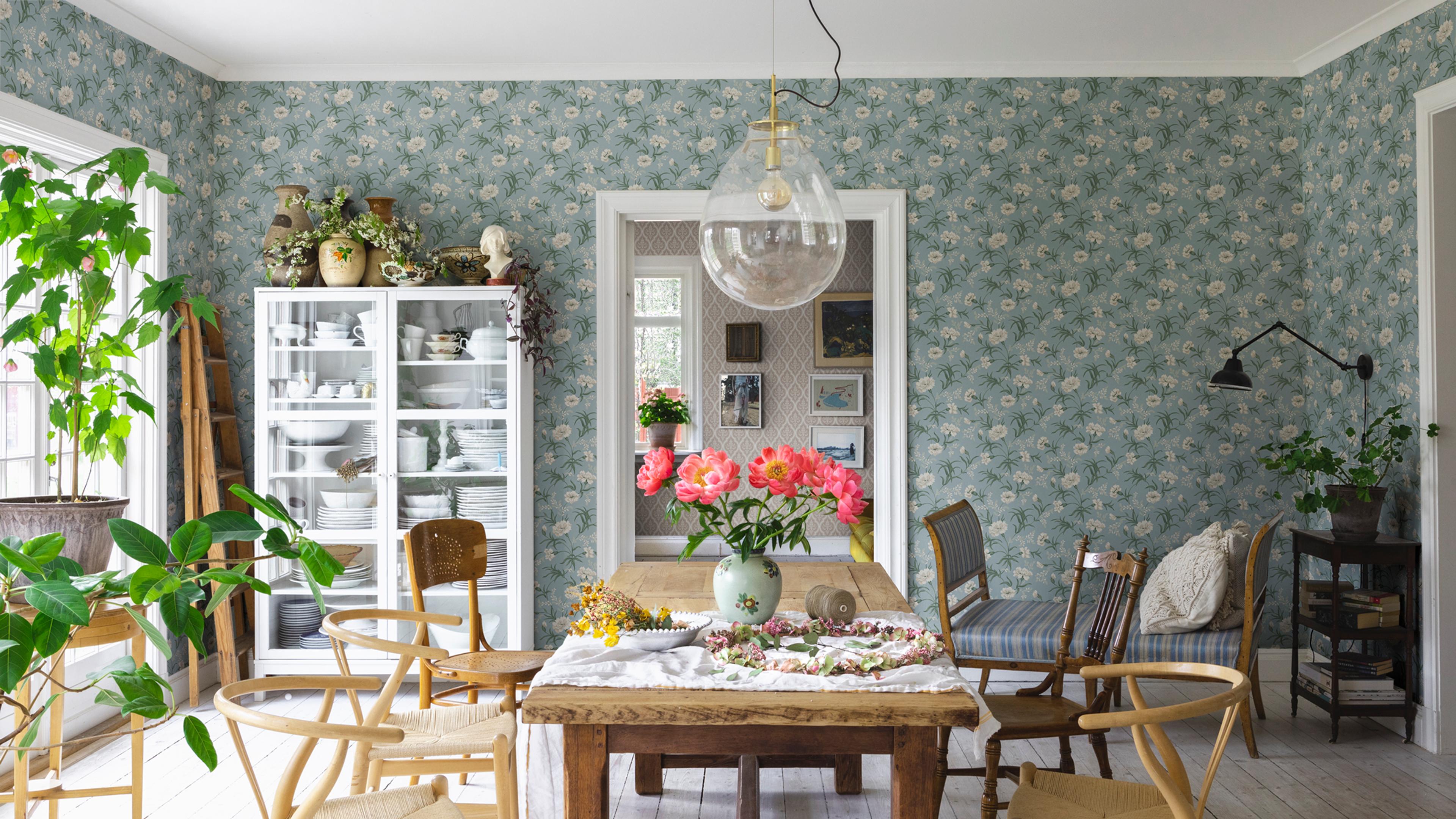 Bright dining room with blue floral wallpaper, a rustic wooden table with pink peonies, and a white display cabinet.​​​​‌﻿‍﻿​‍​‍‌‍﻿﻿‌﻿​‍‌‍‍‌‌‍‌﻿‌‍‍‌‌‍﻿‍​‍​‍​﻿‍‍​‍​‍‌﻿​﻿‌‍​‌‌‍﻿‍‌‍‍‌‌﻿‌​‌﻿‍‌​‍﻿‍‌‍‍‌‌‍﻿﻿​‍​‍​‍﻿​​‍​‍‌‍‍​‌﻿​‍‌‍‌‌‌‍‌‍​‍​‍​﻿‍‍​‍​‍‌‍‍​‌﻿‌​‌﻿‌​‌﻿​​‌﻿​﻿​﻿‍‍​‍﻿﻿​‍﻿﻿‌﻿‌﻿‌﻿‌﻿‌﻿‌﻿​‍﻿‍‌‍​﻿‌‍﻿﻿‌‍﻿​‌‍﻿﻿‌﻿​‍‌‍​‌‌‍﻿‌‌‍​‌​‍﻿‍‌﻿​﻿‌‍‌‌​‍﻿﻿‌﻿​﻿‌﻿‌​‌﻿‌‌‌‍‌​‌‍‍‌‌‍﻿﻿​‍﻿﻿‌‍‍‌‌‍﻿‍‌﻿‌​‌‍‌‌‌‍﻿‍‌﻿‌​​‍﻿﻿‌‍‌‌‌‍‌​‌‍‍‌‌﻿‌​​‍﻿﻿‌‍﻿‌‌‍﻿﻿‌‍‌​‌‍‌‌​﻿﻿‌‌﻿​​‌﻿​‍‌‍‌‌‌﻿​﻿‌‍‌‌‌‍﻿‍‌﻿‌​‌‍​‌‌﻿‌​‌‍‍‌‌‍﻿﻿‌‍﻿‍​﻿‍﻿‌‍‍‌‌‍‌​​﻿﻿‌​﻿‍‌​﻿‌﻿​﻿‌‌‌‍​‍​﻿‌​​﻿​‌‌‍‌​​﻿‍​​‍﻿‌​﻿​​​﻿‌﻿​﻿​﻿​﻿‌‍​‍﻿‌​﻿‌​​﻿‌​‌‍‌‍​﻿​‌​‍﻿‌​﻿‍​‌‍‌‍​﻿​‍​﻿‌​​‍﻿‌‌‍‌​​﻿​﻿​﻿​‍​﻿​‍​﻿‌‌‌‍​‌‌‍‌‌​﻿​﻿‌‍​‌‌‍​﻿‌‍​﻿‌‍​﻿​﻿‍﻿‌﻿‌​‌﻿‍‌‌﻿​​‌‍‌‌​﻿﻿‌‌‍​﻿‌‍﻿﻿‌‍﻿‍‌﻿‌​‌‍‌‌‌‍﻿‍‌﻿‌​‌‌​​‌‍​‌‌‍‌﻿‌‍‌‌​﻿‍﻿‌﻿​​‌‍​‌‌﻿‌​‌‍‍​​﻿﻿‌‌‍​﻿‌‍﻿﻿‌‍﻿‍‌﻿‌​‌‍‌‌‌‍﻿‍‌﻿‌​‌​​‍‌‍﻿​‌‍﻿﻿‌‍​﻿‌‍‍﻿‌﻿​﻿​‍‌‌​﻿‌‌‌​​‍‌‌﻿﻿‌‍‍﻿‌‍‌‌‌﻿‍‌​‍‌‌​﻿​﻿‌​‌​​‍‌‌​﻿​﻿‌​‌​​‍‌‌​﻿​‍​﻿​‍​﻿​‍‌‍​﻿​﻿​﻿​﻿‌‌​﻿‌‍​﻿‍‌​﻿​​‌‍​‍​﻿‌‌‌‍‌​​﻿‍​​﻿‍​​‍‌‌​﻿​‍​﻿​‍​‍‌‌​﻿‌‌‌​‌​​‍﻿‍‌‍‍‌‌﻿‌​‌‍‌‌‌‍﻿‌‌﻿​﻿​‍‌‌​﻿‌‌‌​​‍‌‌﻿﻿‌‍‍﻿‌‍‌‌‌﻿‍‌​‍‌‌​﻿​﻿‌​‌​​‍‌‌​﻿​﻿‌​‌​​‍‌‌​﻿​‍​﻿​‍‌‍‌​‌‍​﻿​﻿​‌​﻿‍‌‌‍‌​‌‍​‌‌‍‌‌​﻿‌﻿‌‍​‌​﻿‍‌​﻿​﻿​﻿‍​​‍‌‌​﻿​‍​﻿​‍​‍‌‌​﻿‌‌‌​‌​​‍﻿‍‌‍﻿‌‌‍‌‌‌‍‌​‌‍‍‌‌‍​‌​‍﻿‍‌‍‍‌‌‍﻿‌‌‍​‌‌‍‌﻿‌‍‌‌​‍﻿‍‌‍​‌‌‍﻿​‌﻿‌​‌‌‌​‌‍‌‌‌﻿‍​‌﻿‌​​﻿﻿﻿‌‍​‍‌‍​‌‌﻿​﻿‌‍‌‌‌‌‌‌‌﻿​‍‌‍﻿​​﻿﻿‌‌‍‍​‌﻿‌​‌﻿‌​‌﻿​​‌﻿​﻿​‍‌‌​﻿​﻿‌​​‌​‍‌‌​﻿​‍‌​‌‍​‍‌‌​﻿​‍‌​‌‍‌﻿‌﻿‌﻿‌﻿‌﻿‌﻿​‍﻿‍‌‍​﻿‌‍﻿﻿‌‍﻿​‌‍﻿﻿‌﻿​‍‌‍​‌‌‍﻿‌‌‍​‌​‍﻿‍‌﻿​﻿‌‍‌‌​‍‌‌​﻿​‍‌​‌‍‌﻿​﻿‌﻿‌​‌﻿‌‌‌‍‌​‌‍‍‌‌‍﻿﻿​‍‌‍‌‍‍‌‌‍‌​​﻿﻿‌​﻿‍‌​﻿‌﻿​﻿‌‌‌‍​‍​﻿‌​​﻿​‌‌‍‌​​﻿‍​​‍﻿‌​﻿​​​﻿‌﻿​﻿​﻿​﻿‌‍​‍﻿‌​﻿‌​​﻿‌​‌‍‌‍​﻿​‌​‍﻿‌​﻿‍​‌‍‌‍​﻿​‍​﻿‌​​‍﻿‌‌‍‌​​﻿​﻿​﻿​‍​﻿​‍​﻿‌‌‌‍​‌‌‍‌‌​﻿​﻿‌‍​‌‌‍​﻿‌‍​﻿‌‍​﻿​‍‌‍‌﻿‌​‌﻿‍‌‌﻿​​‌‍‌‌​﻿﻿‌‌‍​﻿‌‍﻿﻿‌‍﻿‍‌﻿‌​‌‍‌‌‌‍﻿‍‌﻿‌​‌‌​​‌‍​‌‌‍‌﻿‌‍‌‌​‍‌‍‌﻿​​‌‍​‌‌﻿‌​‌‍‍​​﻿﻿‌‌‍​﻿‌‍﻿﻿‌‍﻿‍‌﻿‌​‌‍‌‌‌‍﻿‍‌﻿‌​‌​​‍‌‍﻿​‌‍﻿﻿‌‍​﻿‌‍‍﻿‌﻿​﻿​‍‌‌​﻿‌‌‌​​‍‌‌﻿﻿‌‍‍﻿‌‍‌‌‌﻿‍‌​‍‌‌​﻿​﻿‌​‌​​‍‌‌​﻿​﻿‌​‌​​‍‌‌​﻿​‍​﻿​‍​﻿​‍‌‍​﻿​﻿​﻿​﻿‌‌​﻿‌‍​﻿‍‌​﻿​​‌‍​‍​﻿‌‌‌‍‌​​﻿‍​​﻿‍​​‍‌‌​﻿​‍​﻿​‍​‍‌‌​﻿‌‌‌​‌​​‍﻿‍‌‍‍‌‌﻿‌​‌‍‌‌‌‍﻿‌‌﻿​﻿​‍‌‌​﻿‌‌‌​​‍‌‌﻿﻿‌‍‍﻿‌‍‌‌‌﻿‍‌​‍‌‌​﻿​﻿‌​‌​​‍‌‌​﻿​﻿‌​‌​​‍‌‌​﻿​‍​﻿​‍‌‍‌​‌‍​﻿​﻿​‌​﻿‍‌‌‍‌​‌‍​‌‌‍‌‌​﻿‌﻿‌‍​‌​﻿‍‌​﻿​﻿​﻿‍​​‍‌‌​﻿​‍​﻿​‍​‍‌‌​﻿‌‌‌​‌​​‍﻿‍‌‍﻿‌‌‍‌‌‌‍‌​‌‍‍‌‌‍​‌​‍﻿‍‌‍‍‌‌‍﻿‌‌‍​‌‌‍‌﻿‌‍‌‌​‍﻿‍‌‍​‌‌‍﻿​‌﻿‌​‌‌‌​‌‍‌‌‌﻿‍​‌﻿‌​​‍‌‍‌﻿​​‌‍‌‌‌﻿​‍‌﻿​﻿‌﻿​​‌‍‌‌‌‍​﻿‌﻿‌​‌‍‍‌‌﻿‌‍‌‍‌‌​﻿﻿‌‌﻿​​‌﻿‌‌‌‍​‍‌‍﻿​‌‍‍‌‌﻿​﻿‌‍‍​‌‍‌‌‌‍‌​​‍​‍‌﻿﻿‌