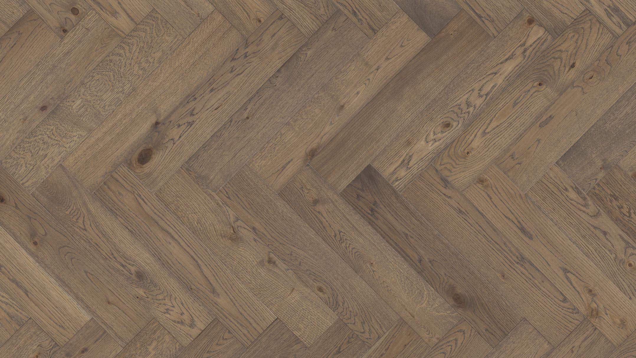 Medium brown wood flooring in a herringbone pattern.