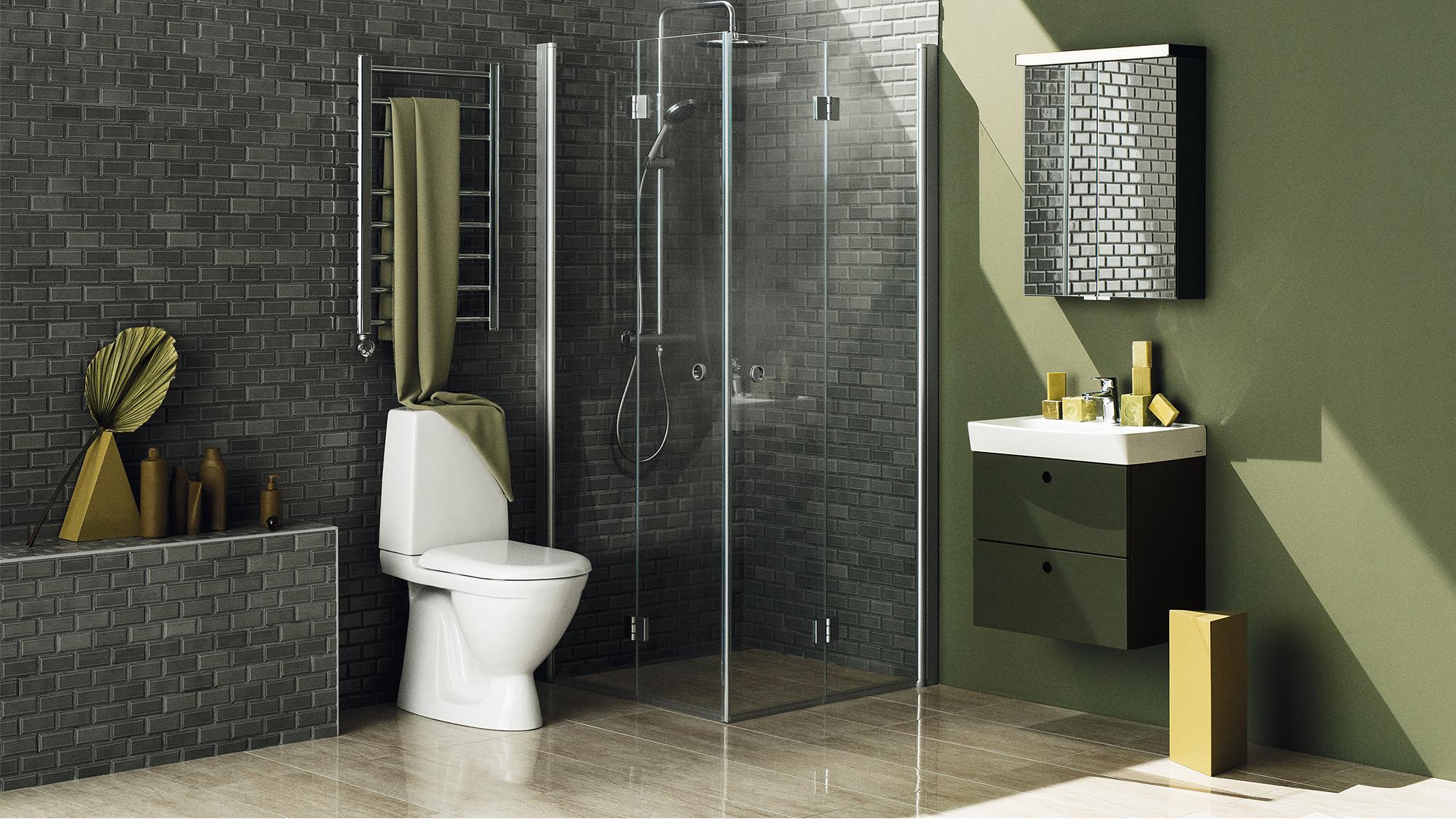 A modern bathroom with a dark brick accent wall, white toilet, glass shower, olive green vanity, and a unique tiled mirror.
