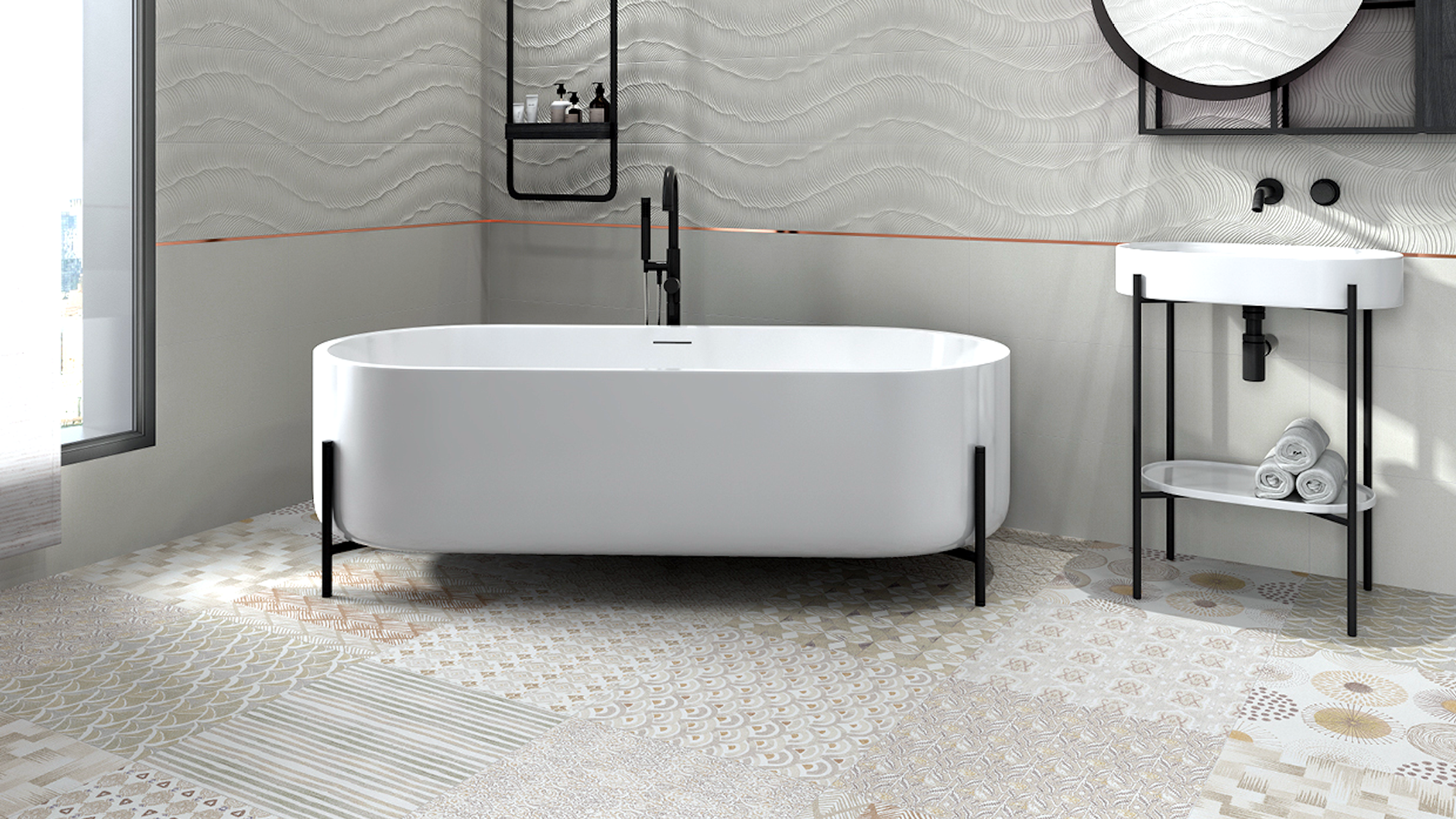 Modern bathroom with a white freestanding tub, pedestal sink, wavy gray wall tiles, and a patterned floor.