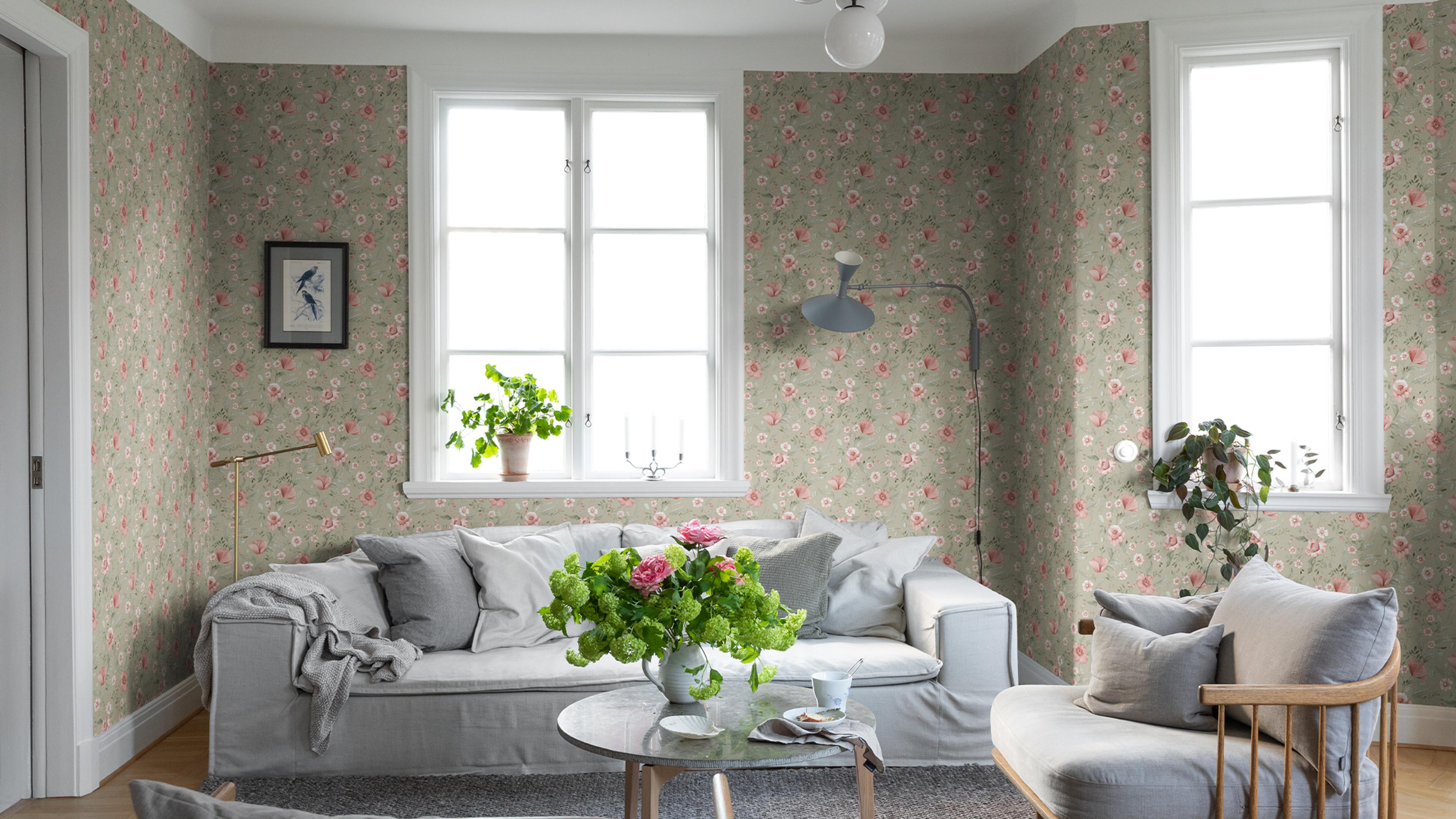A bright living room with light green floral wallpaper, a grey slipcovered sofa, and a glass coffee table topped with pink flowers.​​​​‌﻿‍﻿​‍​‍‌‍﻿﻿‌﻿​‍‌‍‍‌‌‍‌﻿‌‍‍‌‌‍﻿‍​‍​‍​﻿‍‍​‍​‍‌﻿​﻿‌‍​‌‌‍﻿‍‌‍‍‌‌﻿‌​‌﻿‍‌​‍﻿‍‌‍‍‌‌‍﻿﻿​‍​‍​‍﻿​​‍​‍‌‍‍​‌﻿​‍‌‍‌‌‌‍‌‍​‍​‍​﻿‍‍​‍​‍‌‍‍​‌﻿‌​‌﻿‌​‌﻿​​‌﻿​﻿​﻿‍‍​‍﻿﻿​‍﻿﻿‌﻿‌﻿‌﻿‌﻿‌﻿‌﻿​‍﻿‍‌‍​﻿‌‍﻿﻿‌‍﻿​‌‍﻿﻿‌﻿​‍‌‍​‌‌‍﻿‌‌‍​‌​‍﻿‍‌﻿​﻿‌‍‌‌​‍﻿﻿‌﻿​﻿‌﻿‌​‌﻿‌‌‌‍‌​‌‍‍‌‌‍﻿﻿​‍﻿﻿‌‍‍‌‌‍﻿‍‌﻿‌​‌‍‌‌‌‍﻿‍‌﻿‌​​‍﻿﻿‌‍‌‌‌‍‌​‌‍‍‌‌﻿‌​​‍﻿﻿‌‍﻿‌‌‍﻿﻿‌‍‌​‌‍‌‌​﻿﻿‌‌﻿​​‌﻿​‍‌‍‌‌‌﻿​﻿‌‍‌‌‌‍﻿‍‌﻿‌​‌‍​‌‌﻿‌​‌‍‍‌‌‍﻿﻿‌‍﻿‍​﻿‍﻿‌‍‍‌‌‍‌​​﻿﻿‌‌‍​﻿‌‍‌‍​﻿​​​﻿‍‌‌‍‌‌​﻿‌​​﻿​‌​﻿‍‌​‍﻿‌‌‍​﻿‌‍​﻿​﻿​﻿​﻿​​​‍﻿‌​﻿‌​‌‍​‌​﻿‌​‌‍​‍​‍﻿‌‌‍​‌​﻿‌‌‌‍​‍‌‍‌​​‍﻿‌​﻿​‌‌‍​‍​﻿‌﻿​﻿‌​​﻿​‍​﻿‌‌​﻿​​‌‍​﻿​﻿‍‌‌‍‌​​﻿​‌‌‍‌‍​﻿‍﻿‌﻿‌​‌﻿‍‌‌﻿​​‌‍‌‌​﻿﻿‌‌‍​﻿‌‍﻿﻿‌‍﻿‍‌﻿‌​‌‍‌‌‌‍﻿‍‌﻿‌​‌‌​​‌‍​‌‌‍‌﻿‌‍‌‌​﻿‍﻿‌﻿​​‌‍​‌‌﻿‌​‌‍‍​​﻿﻿‌‌‍​﻿‌‍﻿﻿‌‍﻿‍‌﻿‌​‌‍‌‌‌‍﻿‍‌﻿‌​‌​​‍‌‍﻿​‌‍﻿﻿‌‍​﻿‌‍‍﻿‌﻿​﻿​‍‌‌​﻿‌‌‌​​‍‌‌﻿﻿‌‍‍﻿‌‍‌‌‌﻿‍‌​‍‌‌​﻿​﻿‌​‌​​‍‌‌​﻿​﻿‌​‌​​‍‌‌​﻿​‍​﻿​‍​﻿​‍​﻿‌​​﻿‍​​﻿‍​​﻿​​​﻿‍​​﻿‌​​﻿​​​﻿​﻿​﻿​​​﻿​﻿​﻿‍​​‍‌‌​﻿​‍​﻿​‍​‍‌‌​﻿‌‌‌​‌​​‍﻿‍‌‍‍‌‌﻿‌​‌‍‌‌‌‍﻿‌‌﻿​﻿​‍‌‌​﻿‌‌‌​​‍‌‌﻿﻿‌‍‍﻿‌‍‌‌‌﻿‍‌​‍‌‌​﻿​﻿‌​‌​​‍‌‌​﻿​﻿‌​‌​​‍‌‌​﻿​‍​﻿​‍‌‍‌‍​﻿​﻿‌‍‌​‌‍‌​‌‍‌‌​﻿‌​​﻿‍​‌‍​‌‌‍​‌​﻿‌‍​﻿‌‌‌‍​‍​‍‌‌​﻿​‍​﻿​‍​‍‌‌​﻿‌‌‌​‌​​‍﻿‍‌‍﻿‌‌‍‌‌‌‍‌​‌‍‍‌‌‍​‌​‍﻿‍‌‍‍‌‌‍﻿‌‌‍​‌‌‍‌﻿‌‍‌‌​‍﻿‍‌‍​‌‌‍﻿​‌﻿‌​‌‌‌​‌‍‌‌‌﻿‍​‌﻿‌​​﻿﻿﻿‌‍​‍‌‍​‌‌﻿​﻿‌‍‌‌‌‌‌‌‌﻿​‍‌‍﻿​​﻿﻿‌‌‍‍​‌﻿‌​‌﻿‌​‌﻿​​‌﻿​﻿​‍‌‌​﻿​﻿‌​​‌​‍‌‌​﻿​‍‌​‌‍​‍‌‌​﻿​‍‌​‌‍‌﻿‌﻿‌﻿‌﻿‌﻿‌﻿​‍﻿‍‌‍​﻿‌‍﻿﻿‌‍﻿​‌‍﻿﻿‌﻿​‍‌‍​‌‌‍﻿‌‌‍​‌​‍﻿‍‌﻿​﻿‌‍‌‌​‍‌‌​﻿​‍‌​‌‍‌﻿​﻿‌﻿‌​‌﻿‌‌‌‍‌​‌‍‍‌‌‍﻿﻿​‍‌‍‌‍‍‌‌‍‌​​﻿﻿‌‌‍​﻿‌‍‌‍​﻿​​​﻿‍‌‌‍‌‌​﻿‌​​﻿​‌​﻿‍‌​‍﻿‌‌‍​﻿‌‍​﻿​﻿​﻿​﻿​​​‍﻿‌​﻿‌​‌‍​‌​﻿‌​‌‍​‍​‍﻿‌‌‍​‌​﻿‌‌‌‍​‍‌‍‌​​‍﻿‌​﻿​‌‌‍​‍​﻿‌﻿​﻿‌​​﻿​‍​﻿‌‌​﻿​​‌‍​﻿​﻿‍‌‌‍‌​​﻿​‌‌‍‌‍​‍‌‍‌﻿‌​‌﻿‍‌‌﻿​​‌‍‌‌​﻿﻿‌‌‍​﻿‌‍﻿﻿‌‍﻿‍‌﻿‌​‌‍‌‌‌‍﻿‍‌﻿‌​‌‌​​‌‍​‌‌‍‌﻿‌‍‌‌​‍‌‍‌﻿​​‌‍​‌‌﻿‌​‌‍‍​​﻿﻿‌‌‍​﻿‌‍﻿﻿‌‍﻿‍‌﻿‌​‌‍‌‌‌‍﻿‍‌﻿‌​‌​​‍‌‍﻿​‌‍﻿﻿‌‍​﻿‌‍‍﻿‌﻿​﻿​‍‌‌​﻿‌‌‌​​‍‌‌﻿﻿‌‍‍﻿‌‍‌‌‌﻿‍‌​‍‌‌​﻿​﻿‌​‌​​‍‌‌​﻿​﻿‌​‌​​‍‌‌​﻿​‍​﻿​‍​﻿​‍​﻿‌​​﻿‍​​﻿‍​​﻿​​​﻿‍​​﻿‌​​﻿​​​﻿​﻿​﻿​​​﻿​﻿​﻿‍​​‍‌‌​﻿​‍​﻿​‍​‍‌‌​﻿‌‌‌​‌​​‍﻿‍‌‍‍‌‌﻿‌​‌‍‌‌‌‍﻿‌‌﻿​﻿​‍‌‌​﻿‌‌‌​​‍‌‌﻿﻿‌‍‍﻿‌‍‌‌‌﻿‍‌​‍‌‌​﻿​﻿‌​‌​​‍‌‌​﻿​﻿‌​‌​​‍‌‌​﻿​‍​﻿​‍‌‍‌‍​﻿​﻿‌‍‌​‌‍‌​‌‍‌‌​﻿‌​​﻿‍​‌‍​‌‌‍​‌​﻿‌‍​﻿‌‌‌‍​‍​‍‌‌​﻿​‍​﻿​‍​‍‌‌​﻿‌‌‌​‌​​‍﻿‍‌‍﻿‌‌‍‌‌‌‍‌​‌‍‍‌‌‍​‌​‍﻿‍‌‍‍‌‌‍﻿‌‌‍​‌‌‍‌﻿‌‍‌‌​‍﻿‍‌‍​‌‌‍﻿​‌﻿‌​‌‌‌​‌‍‌‌‌﻿‍​‌﻿‌​​‍‌‍‌﻿​​‌‍‌‌‌﻿​‍‌﻿​﻿‌﻿​​‌‍‌‌‌‍​﻿‌﻿‌​‌‍‍‌‌﻿‌‍‌‍‌‌​﻿﻿‌‌﻿​​‌﻿‌‌‌‍​‍‌‍﻿​‌‍‍‌‌﻿​﻿‌‍‍​‌‍‌‌‌‍‌​​‍​‍‌﻿﻿‌