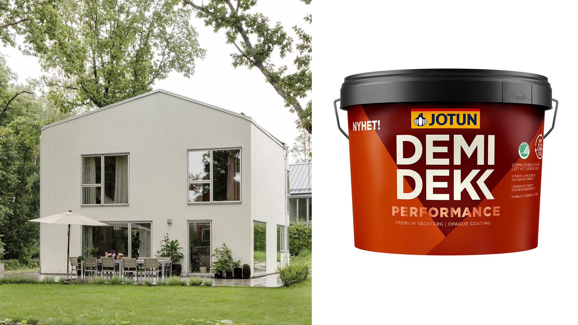 A modern light-colored house with a lawn and patio, next to a bucket of Jotun Demidekk Performance paint.