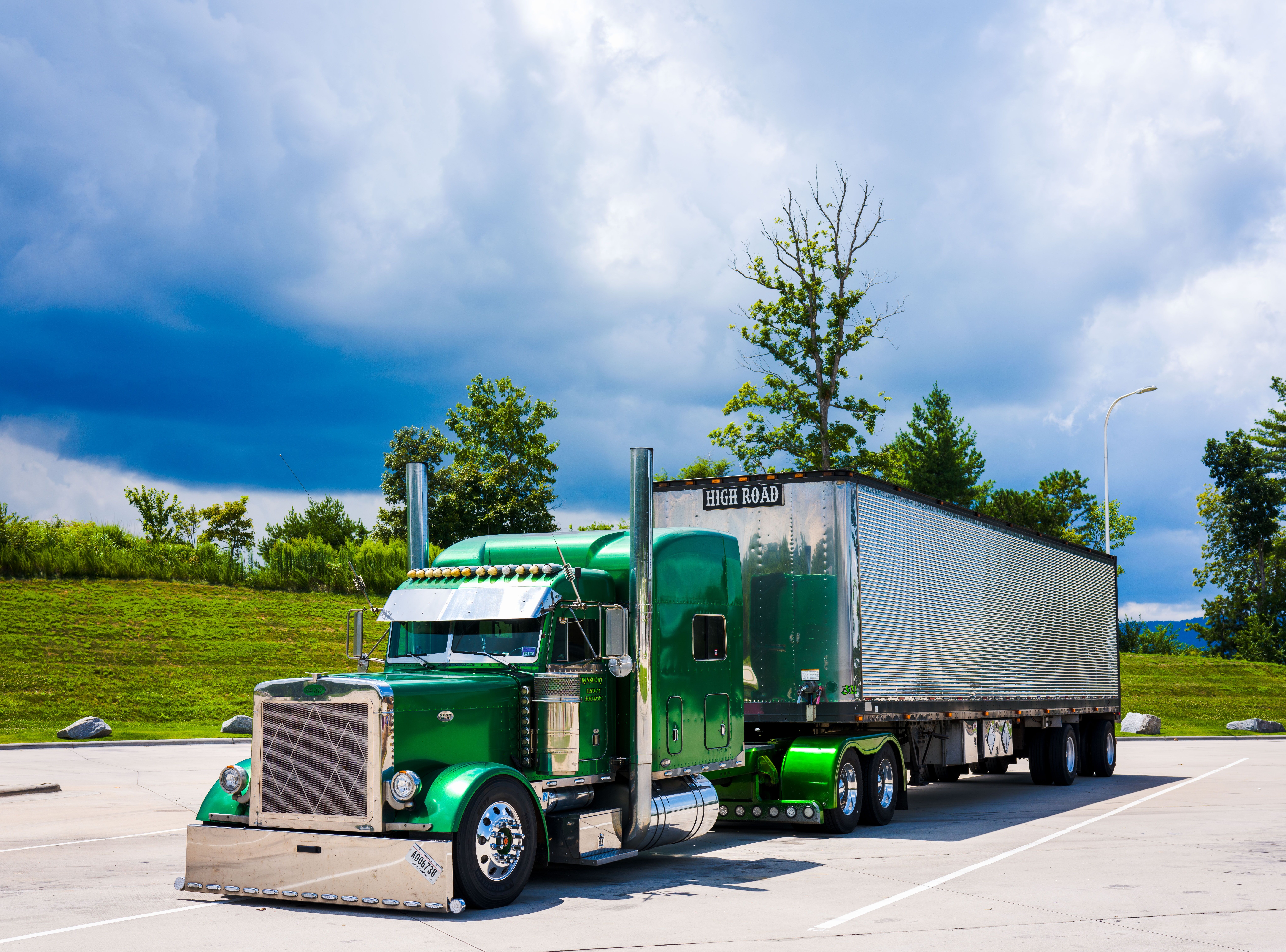 Image Green semi-truck hauling a silver trailer parked in a lot, illustrating Pennsylvania truck accident liability
