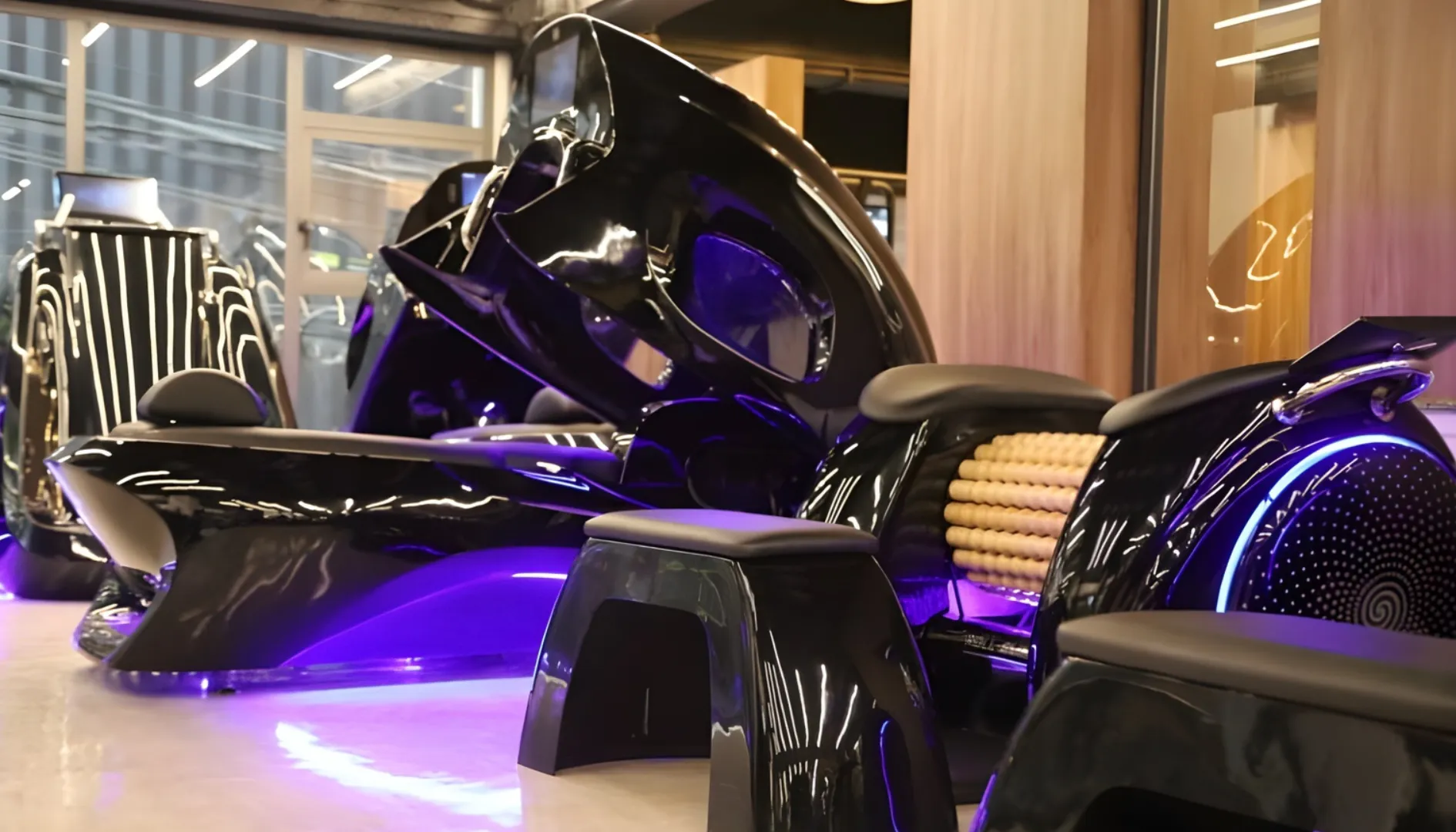 Cabinas y equipos futuristas con iluminación LED violeta en el área de bienestar de Radiance Body Lab.