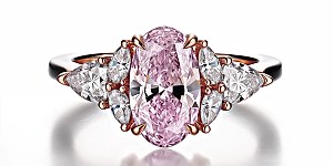 Pink diamond oval engagement ring.