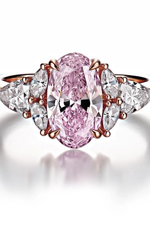 Pink diamond oval engagement ring.