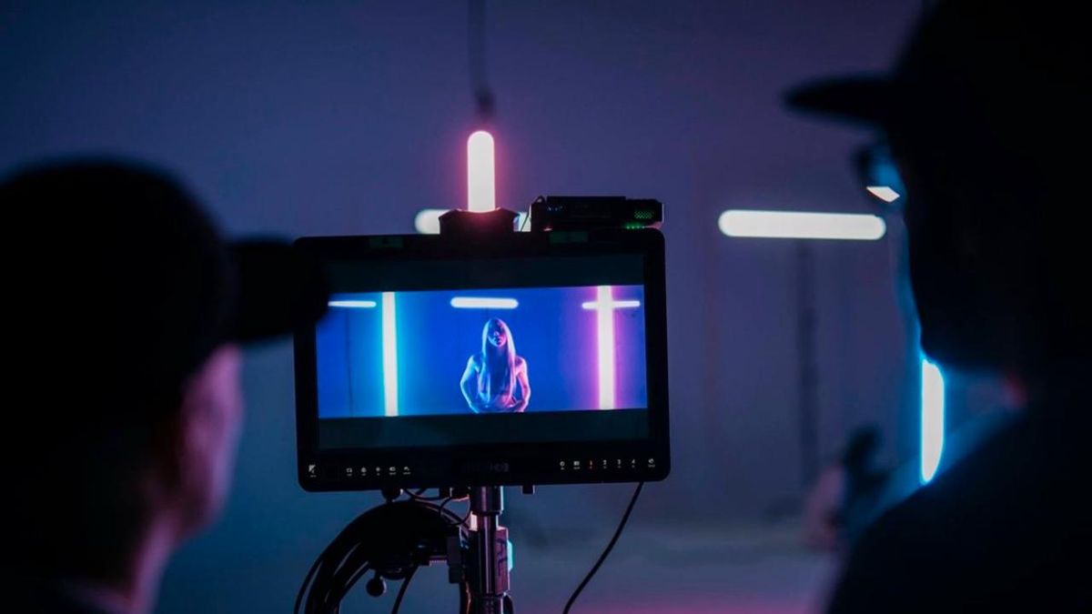 Cinematic music video production setup with RGB tube lights, captured on monitor screen inside a creative studio in India booked via BOOKD.