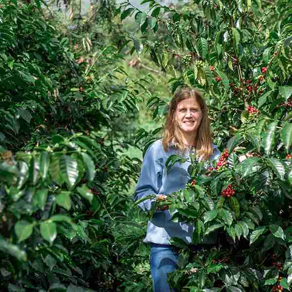 posing for photo on coffee farm